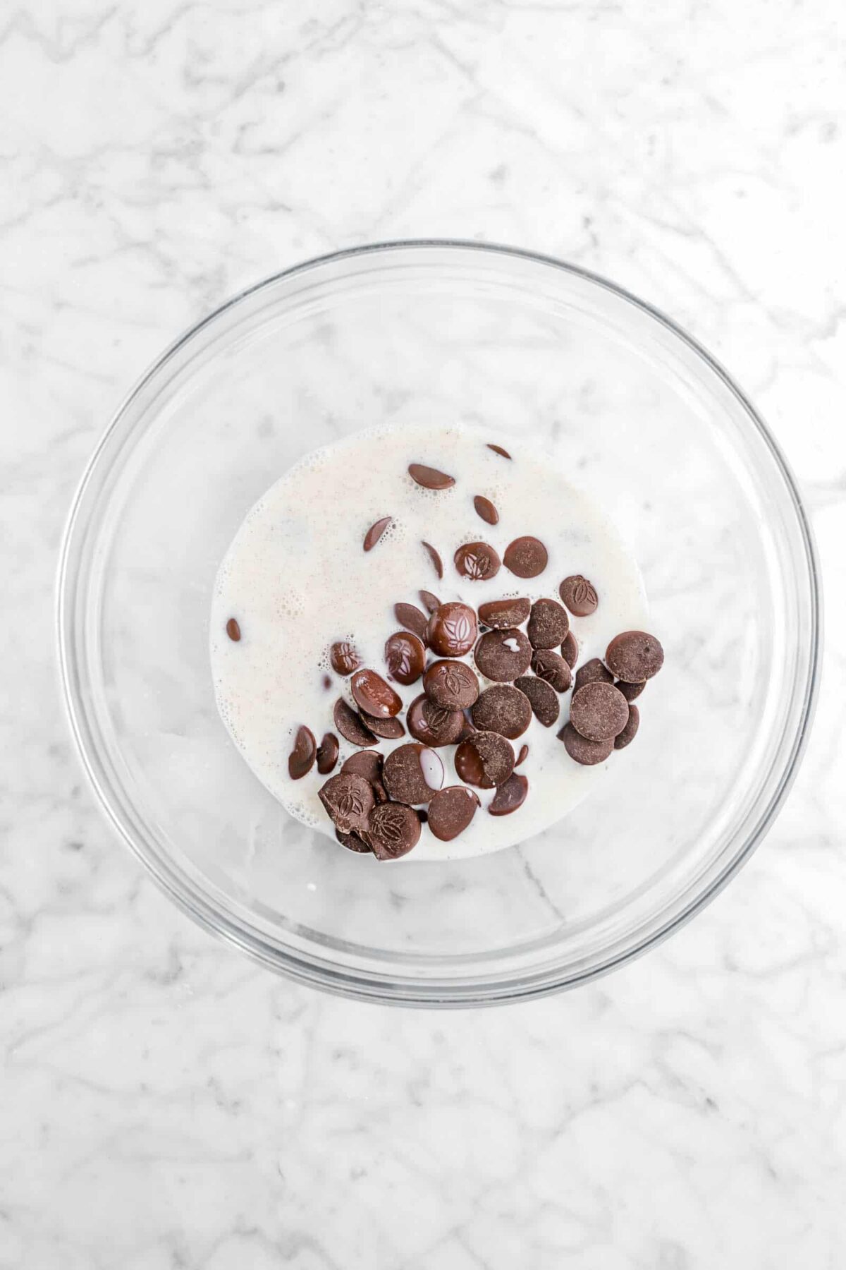 cream and chocolate chips in glass bowl