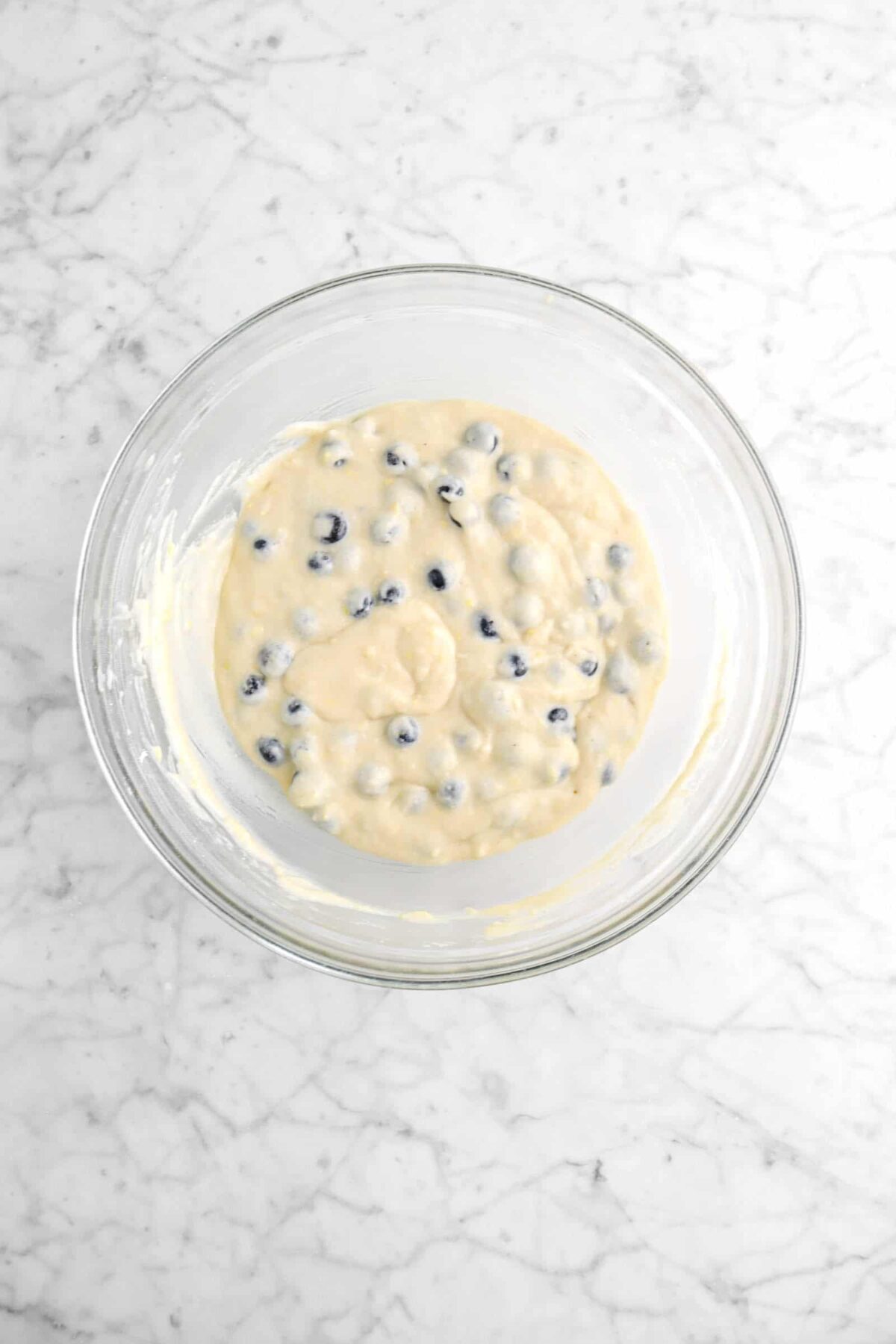 blueberry muffin batter in glass bowl