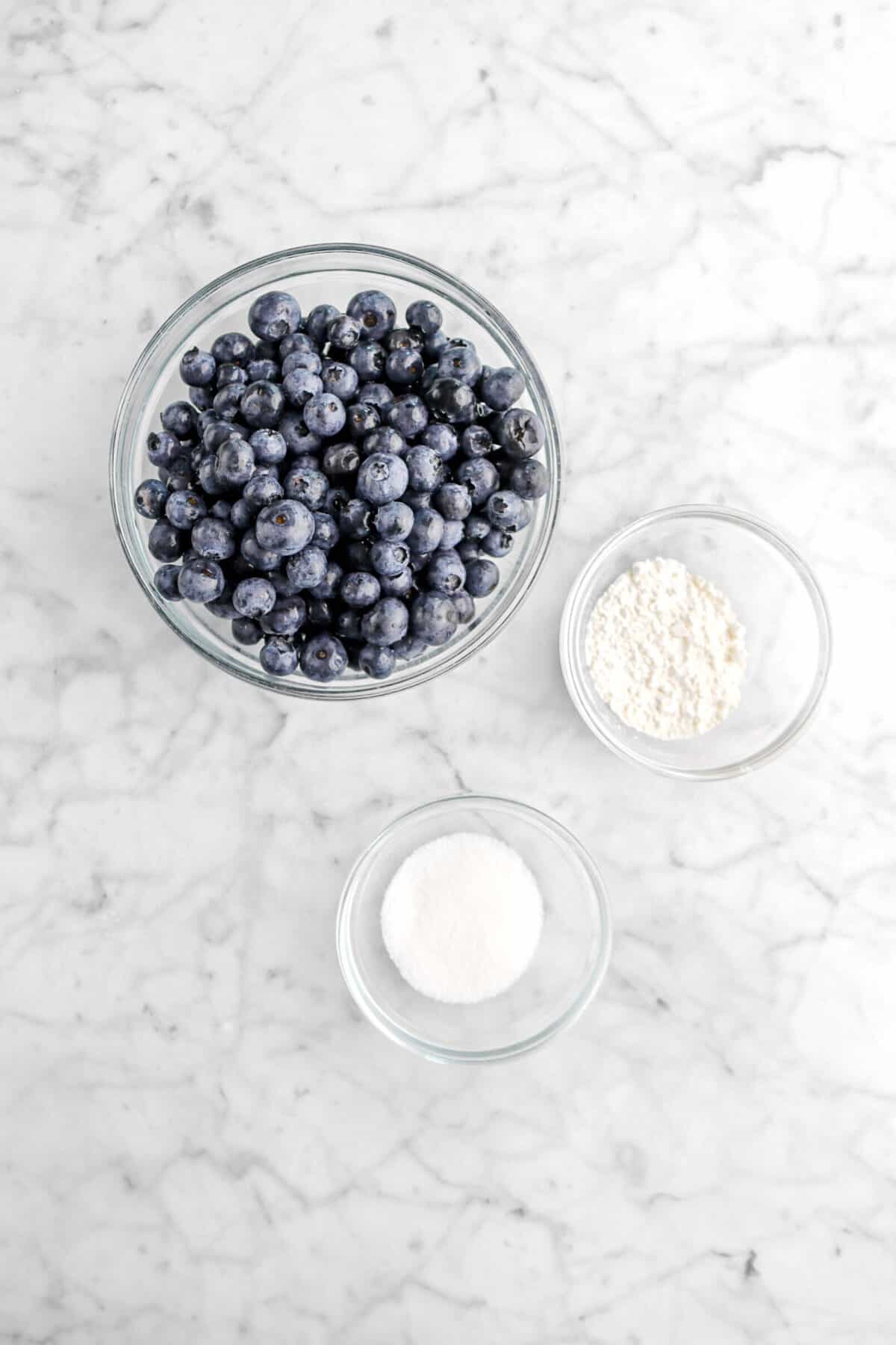 blueberries, flour, and salt in glass bowls