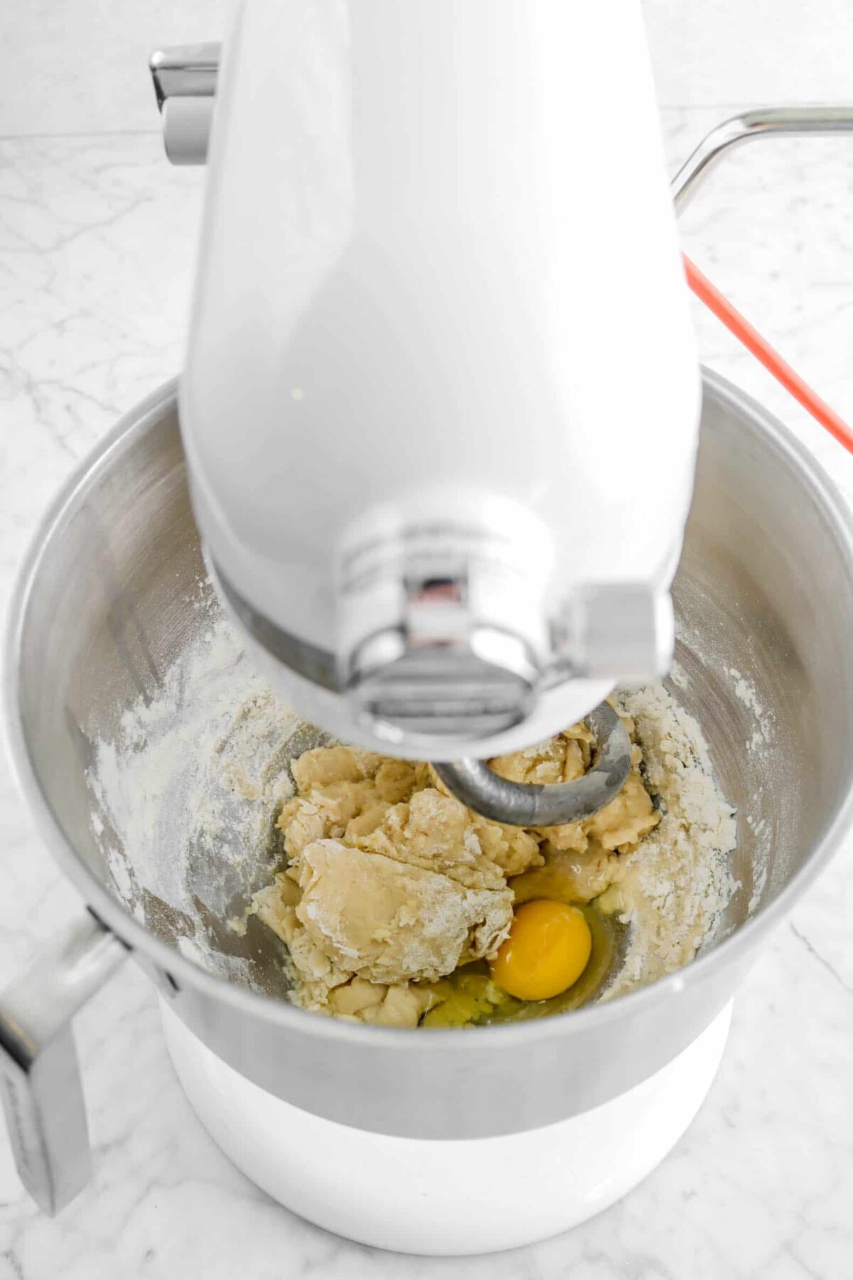 dough with egg in mixer bowl