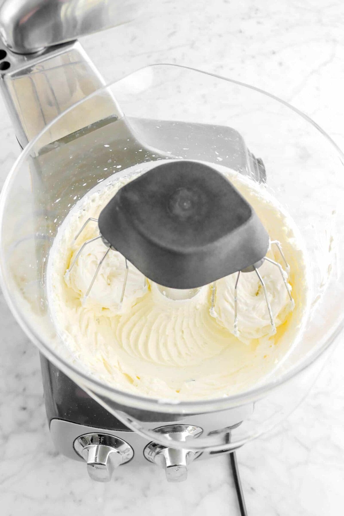 cream cheese and heavy cream mixture in mixer