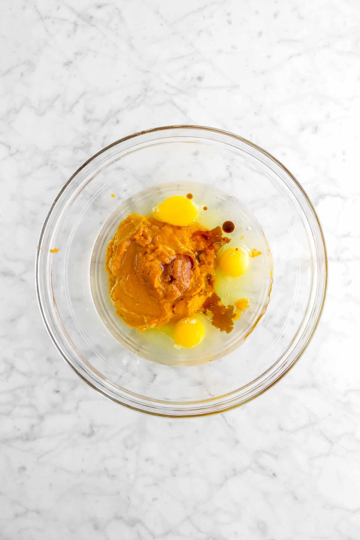 pumpkin, eggs, vanilla, and vegetable oil in a glass bowl