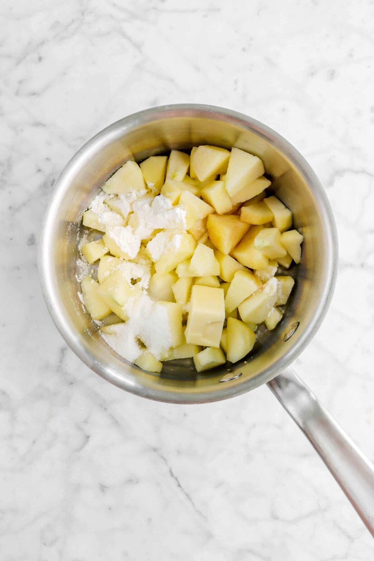 chopped apples, corn starch, vanilla, and sugar in a pot