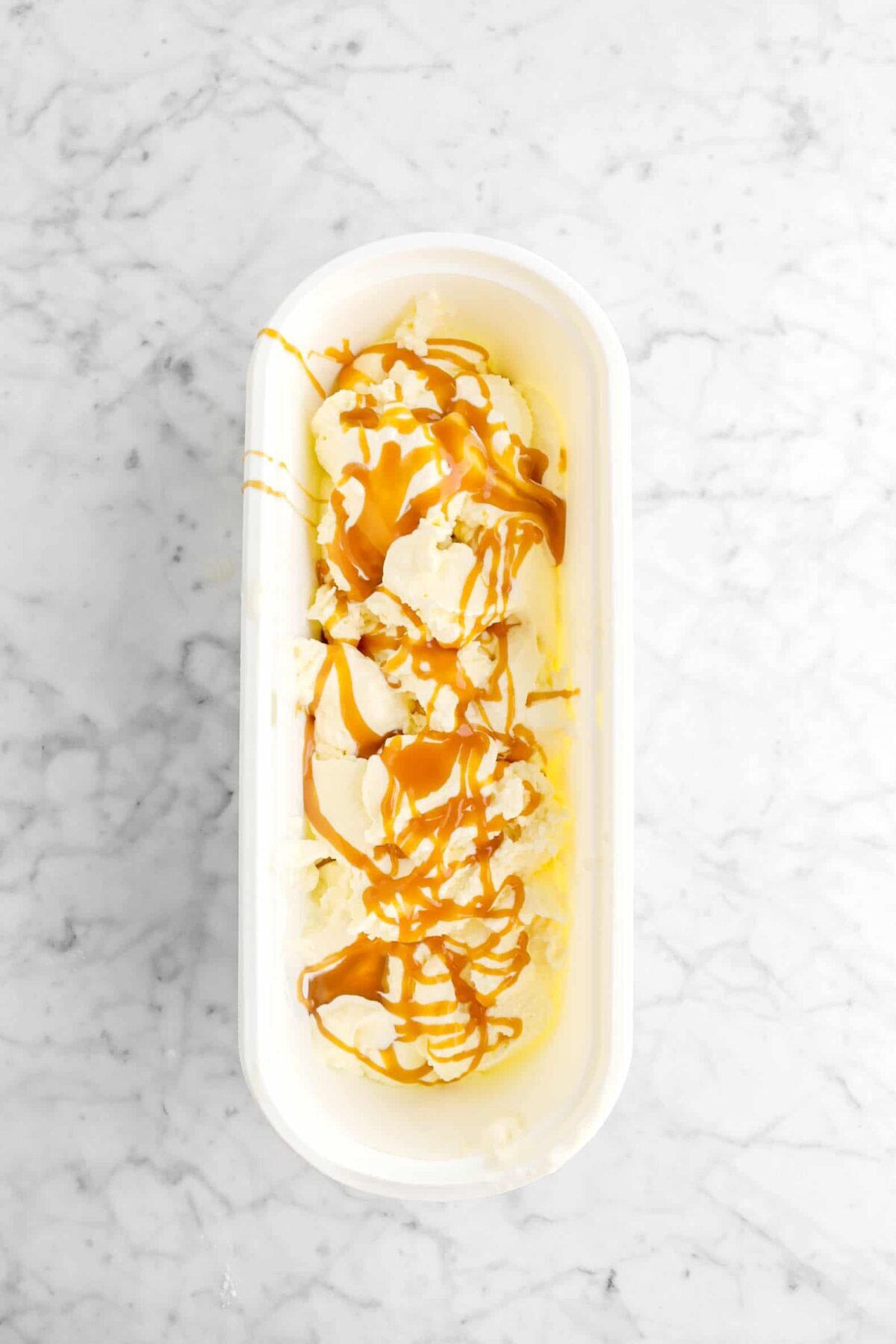 ice cream and caramel in container
