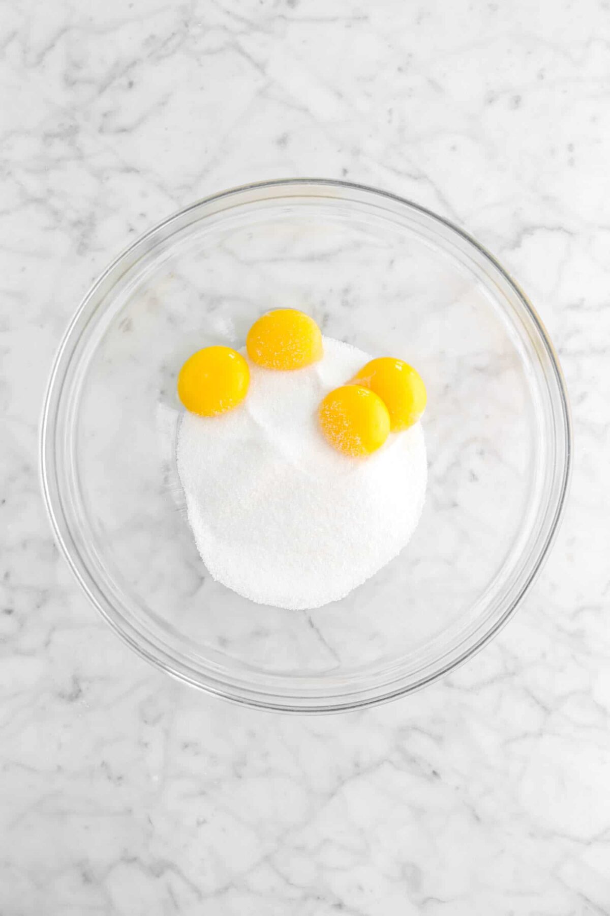 egg yolks and sugar in in bowl
