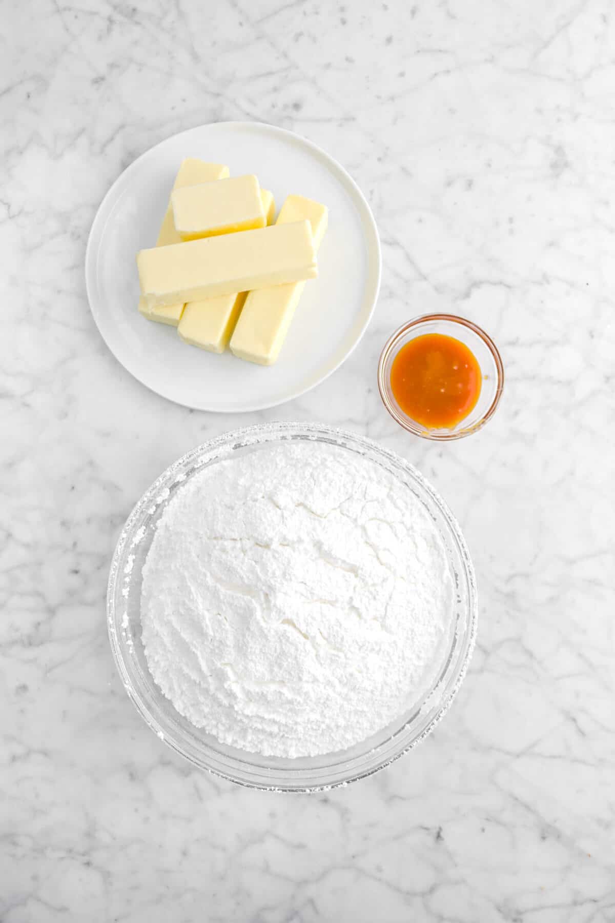 butter, caramel, and powdered sugar in marble counter