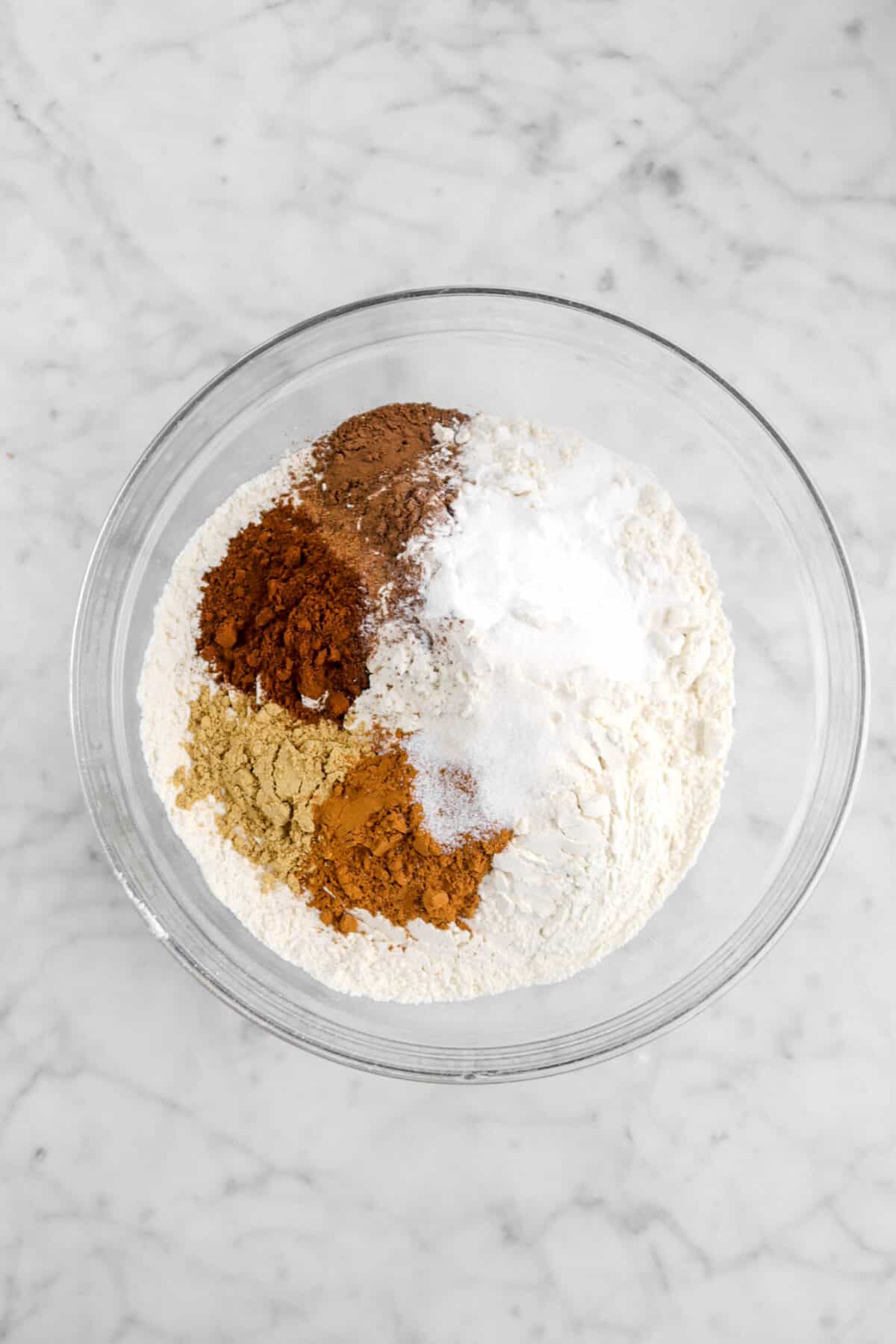 spices, flour, baking soda, and salt in glass bowl
