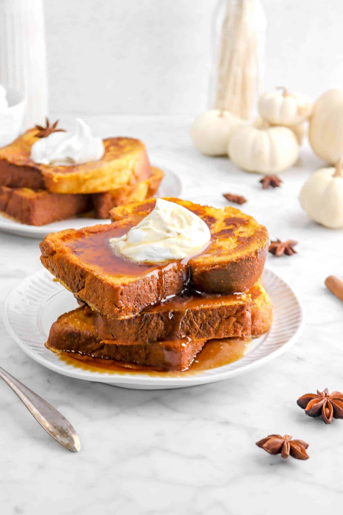 stacked french toast with whole white pumpkins