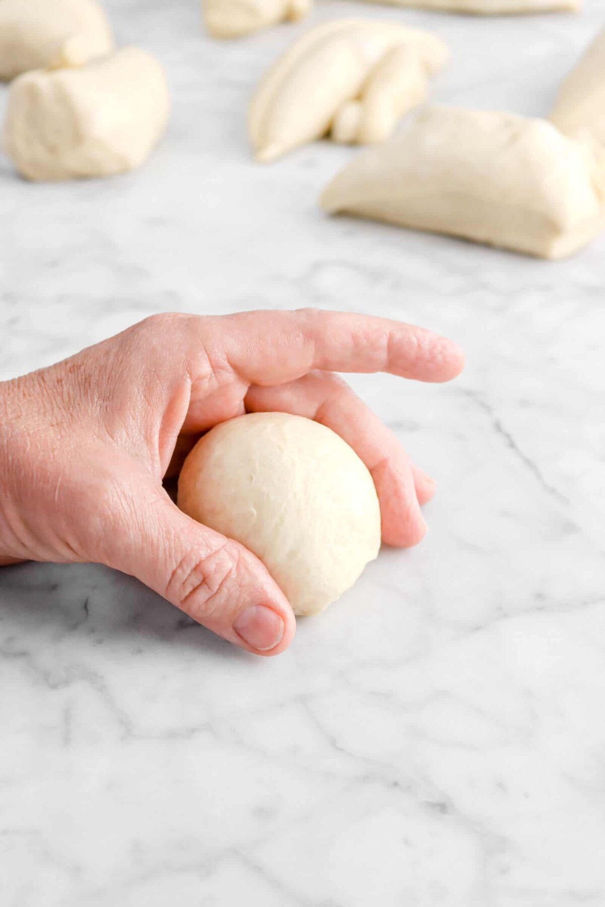 hand around dough ball