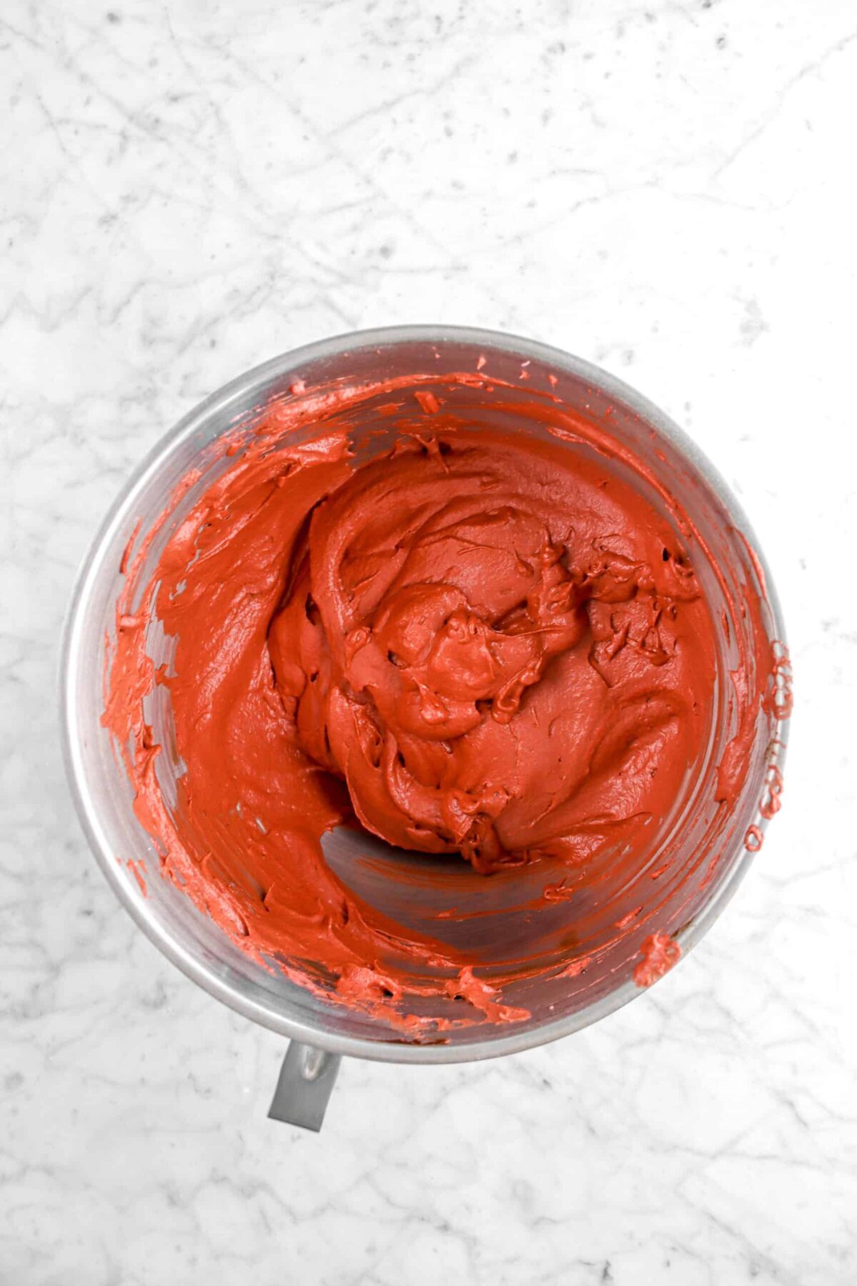 red cake batter in mixer