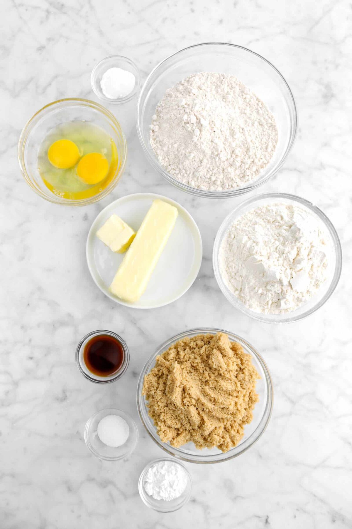 baking powder, eggs, oat flour, butter, all-purpose flour, brown sugar, baking powder, salt, vanilla in glass bowls