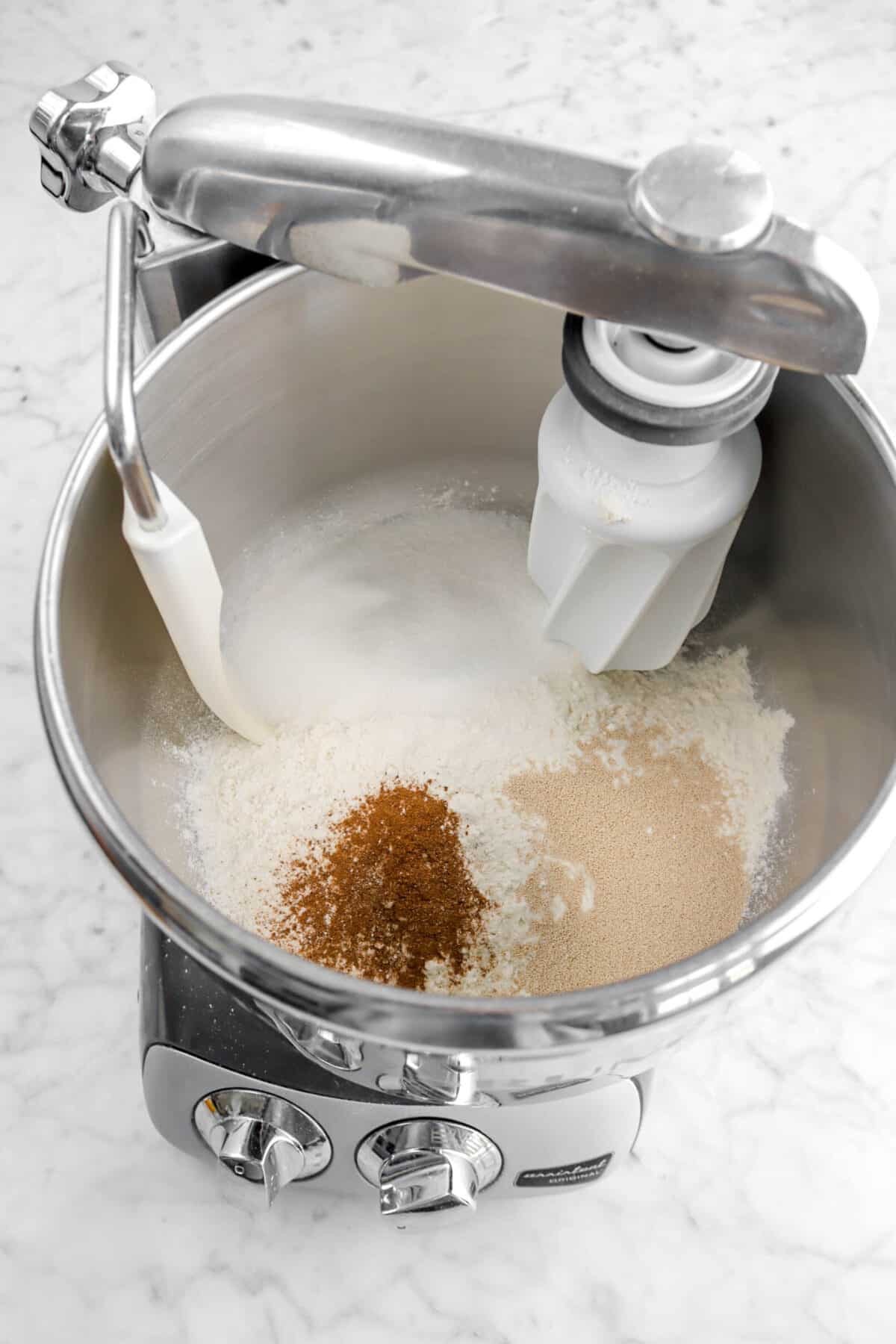 flour, sugar, spice, and yeast in mixer