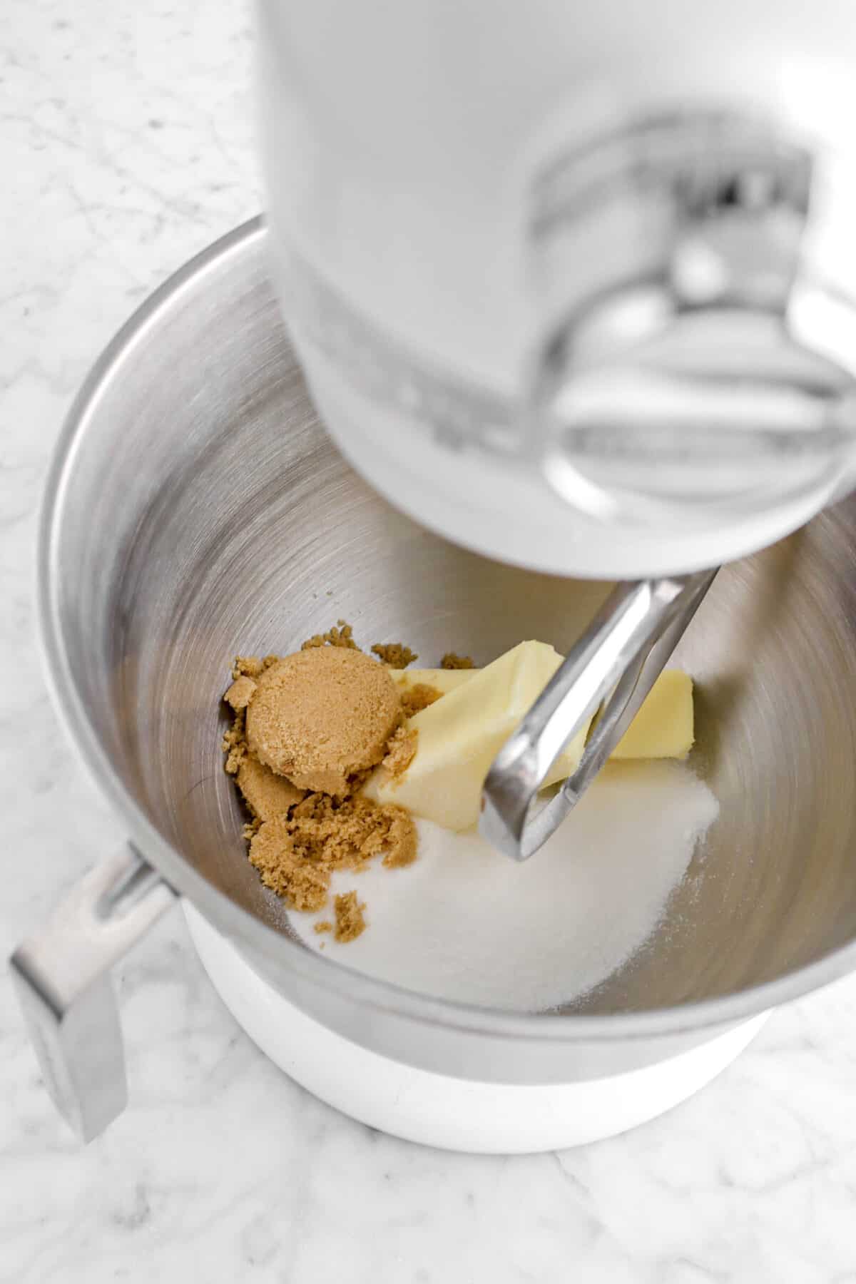 brown sugar, white sugar, and butter in a mixer