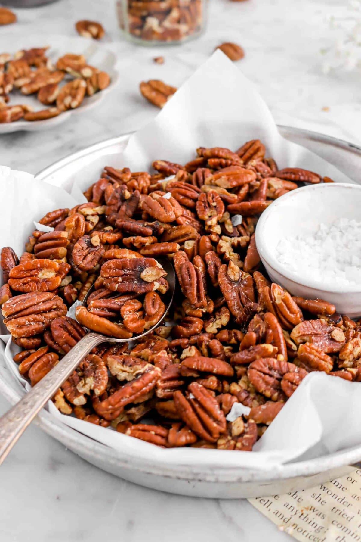 close up of spoonful of roasted pecans
