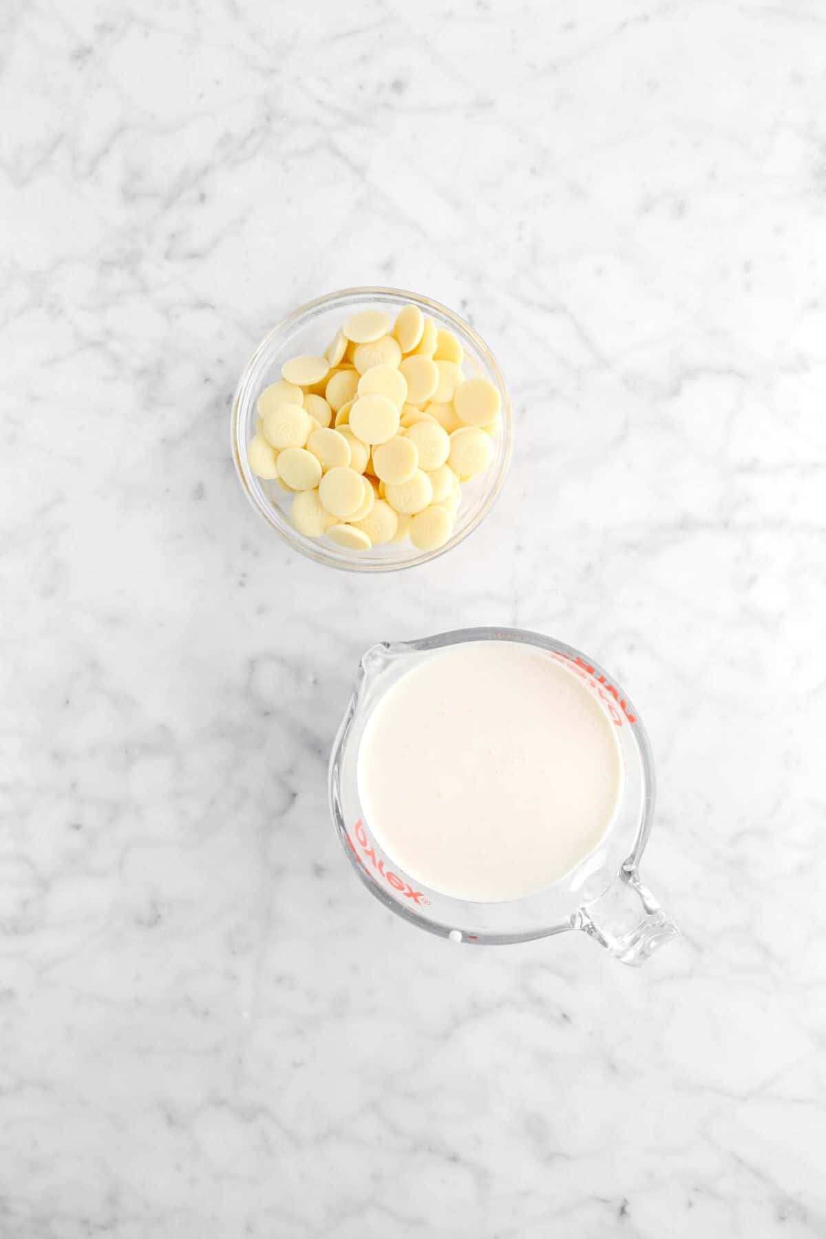 white chocolate and heavy cream on marble counter