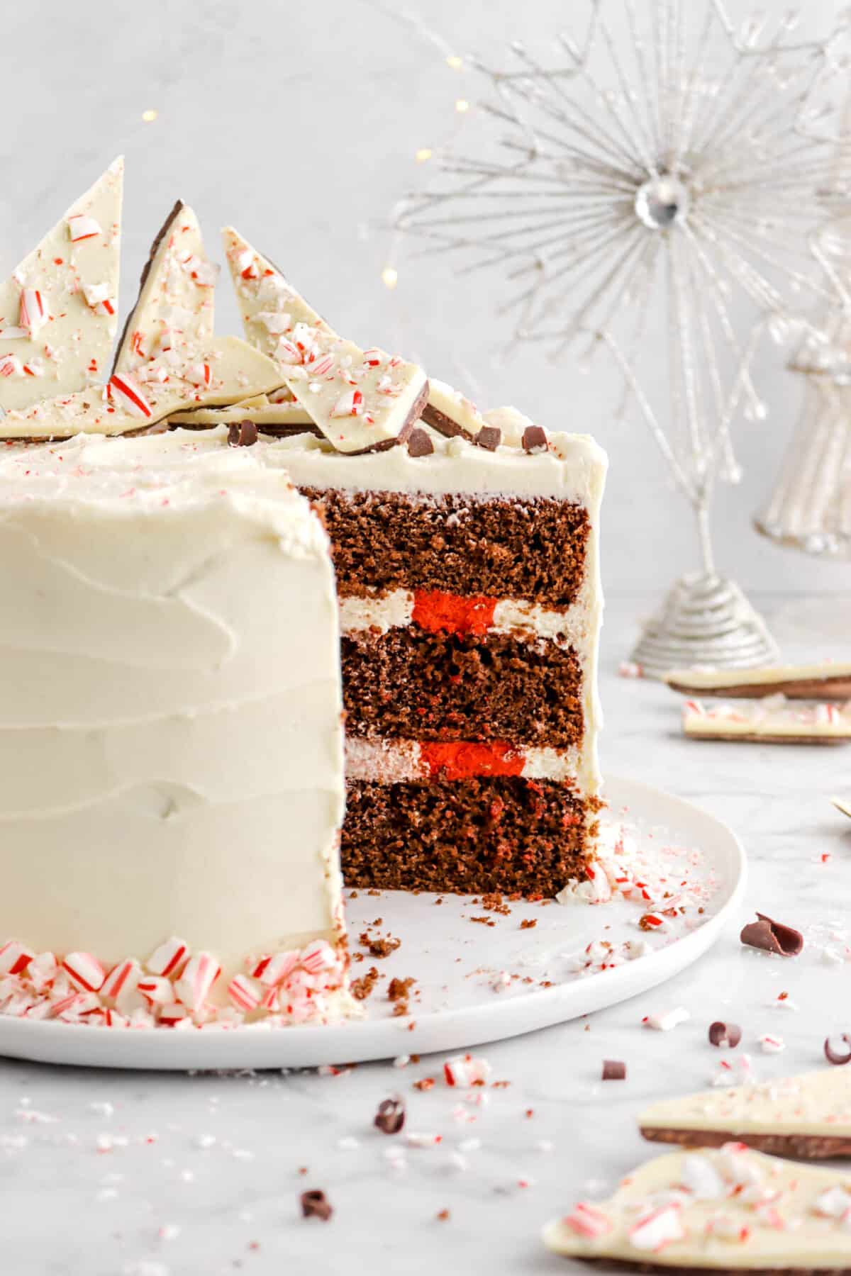 close up of slice cake with red and white stripes in the middle