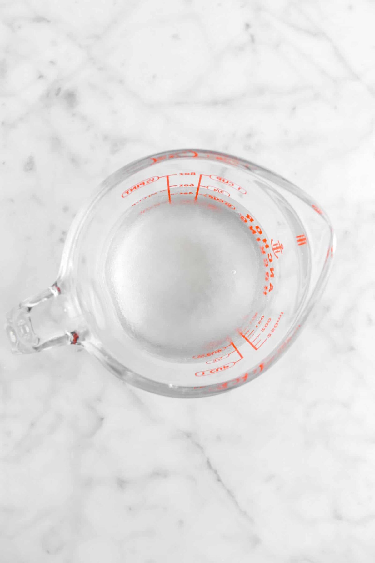 corn syrup and water in measuring cup
