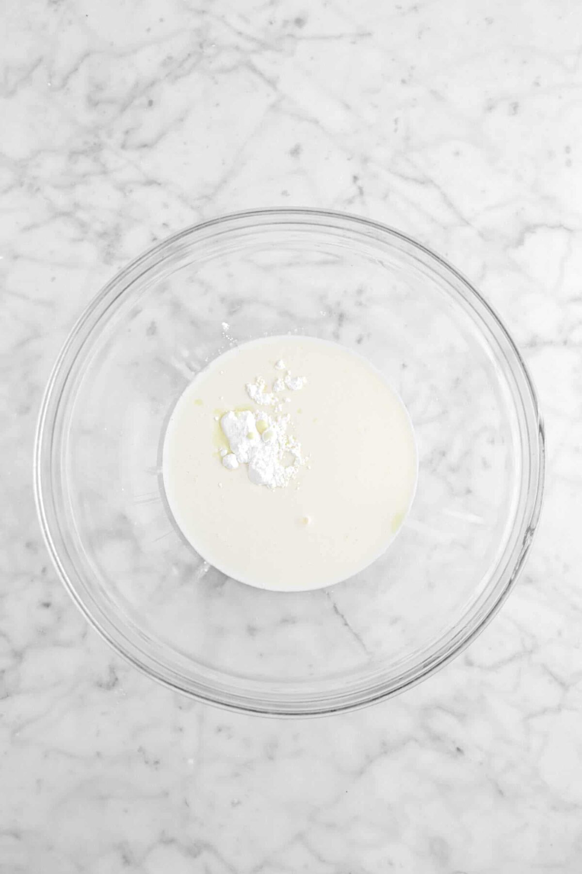 heavy cream, eggnog, and powdered sugar in glass bowl