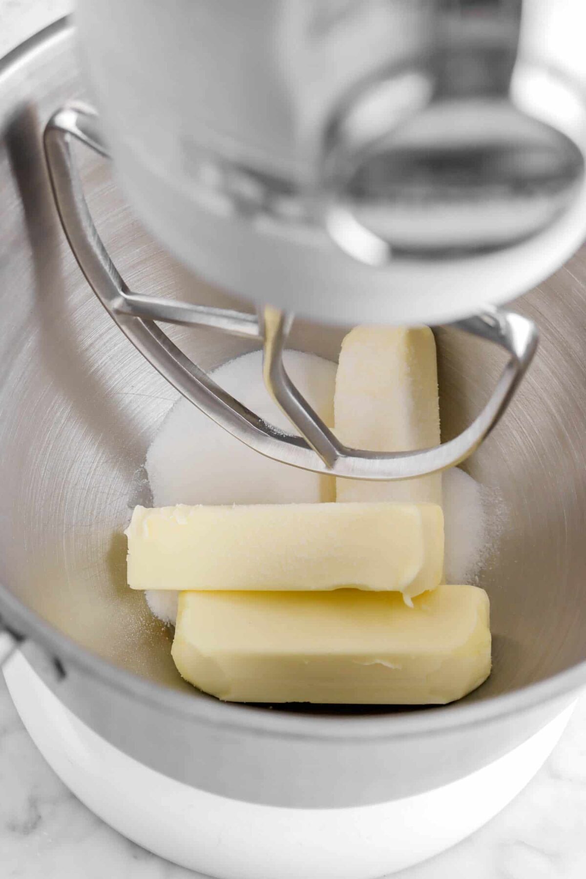 sticks of butter and sugar in mixer