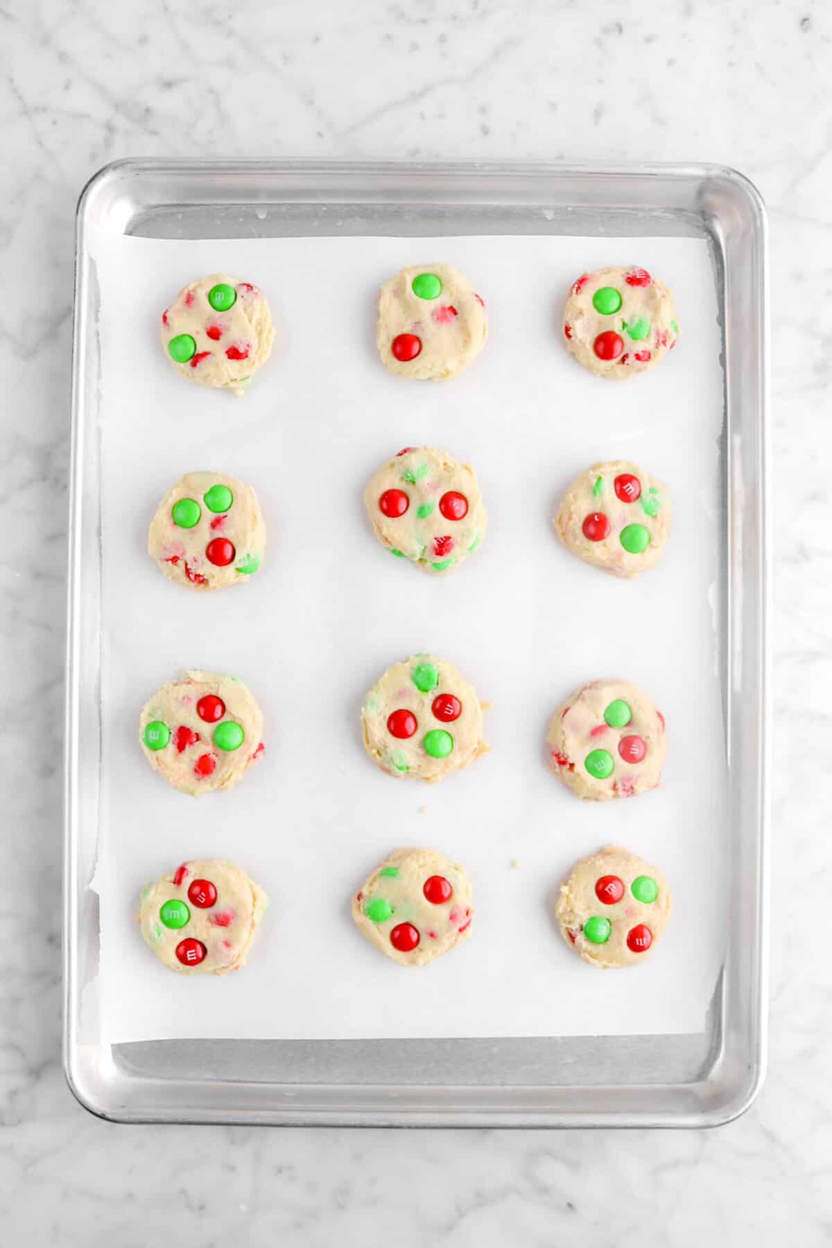 twelve cookies on lined sheet pan