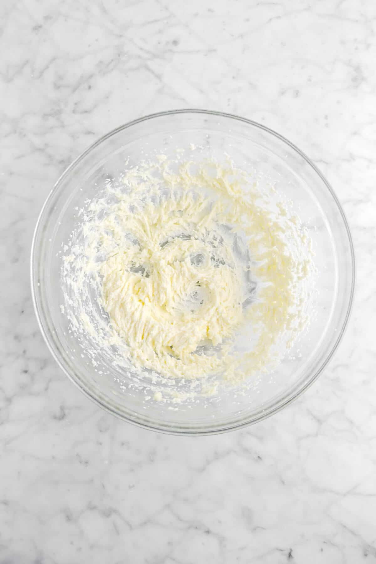 creamed butter and sugar in glass bowl