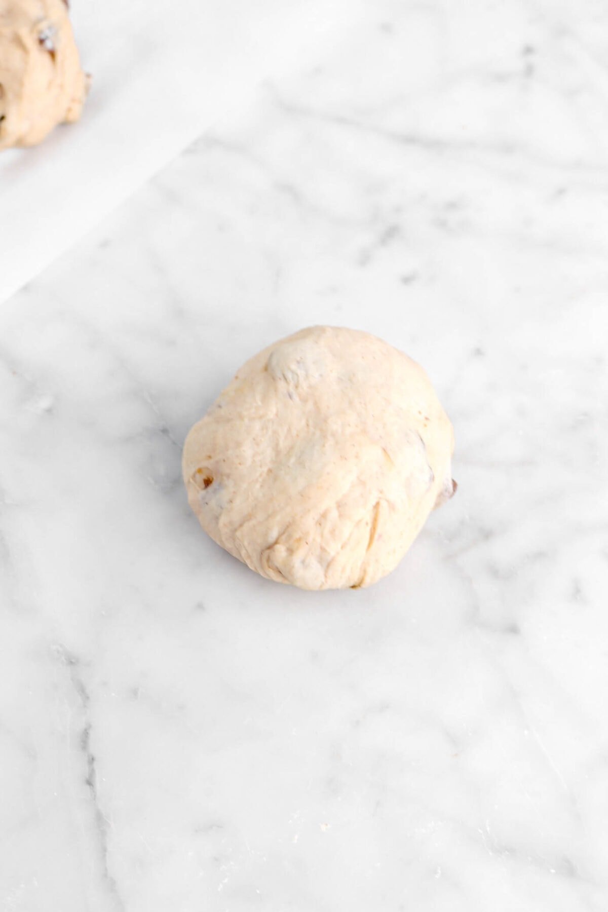 ball of dough on marble counter
