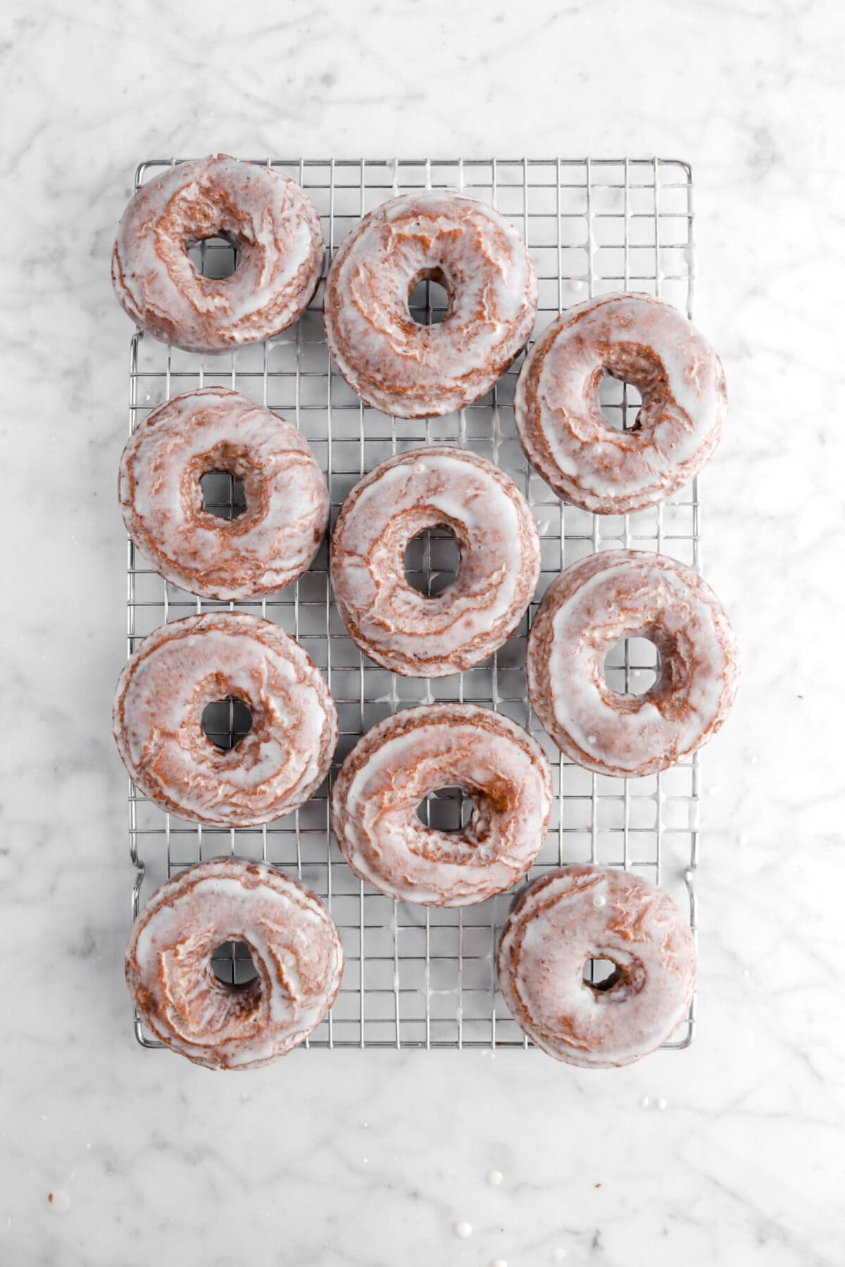 glazed doughnuts on cooling rack
