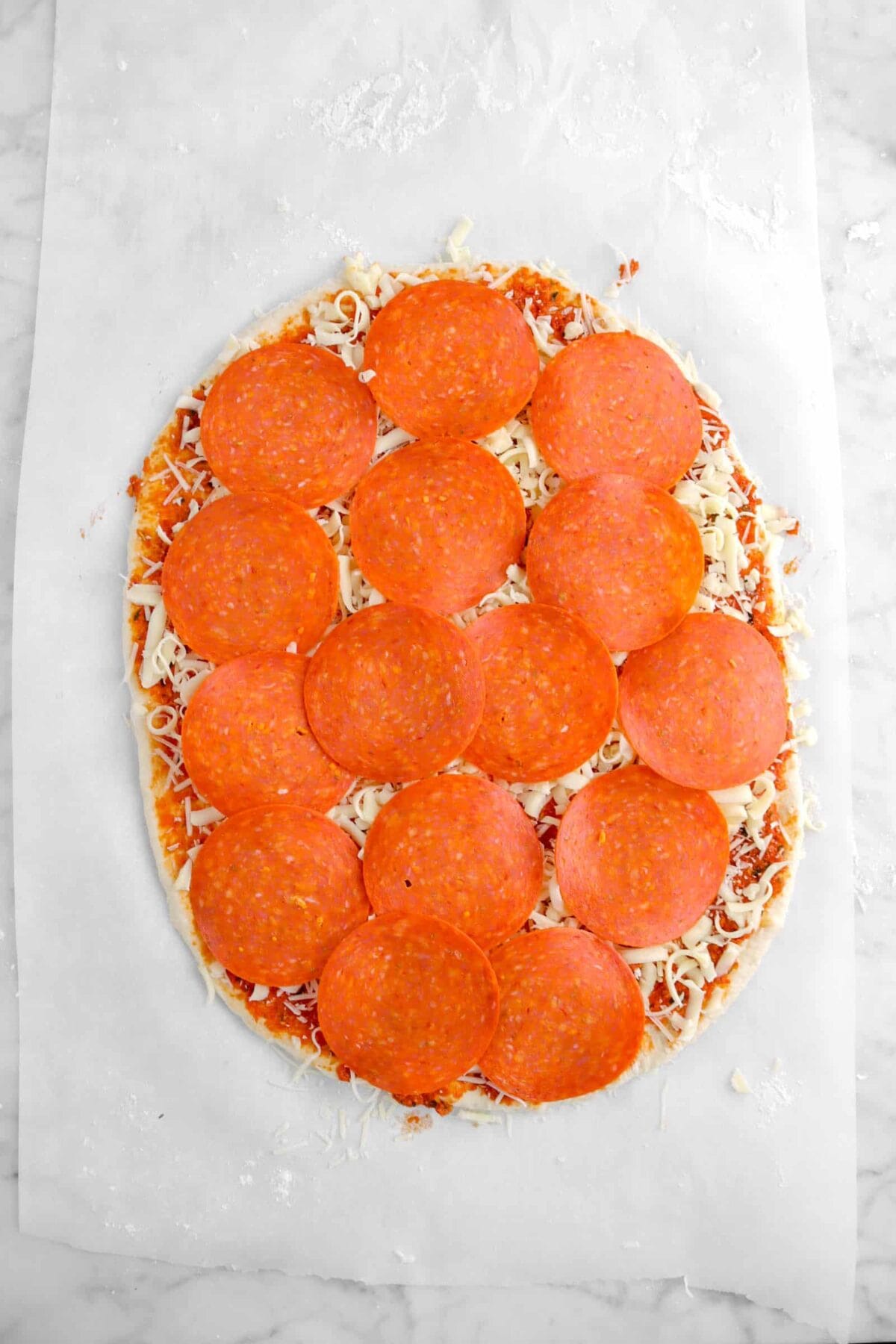 pepperoni added on top of mozzarella