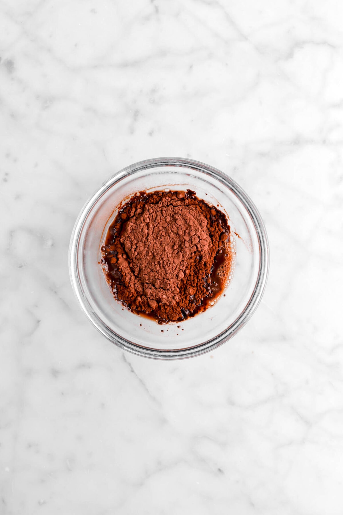 cocoa powder and water in small glass bowl