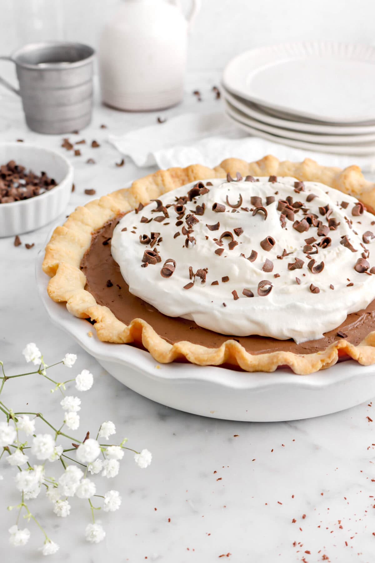 close up of pie with flowers and chocolate curls