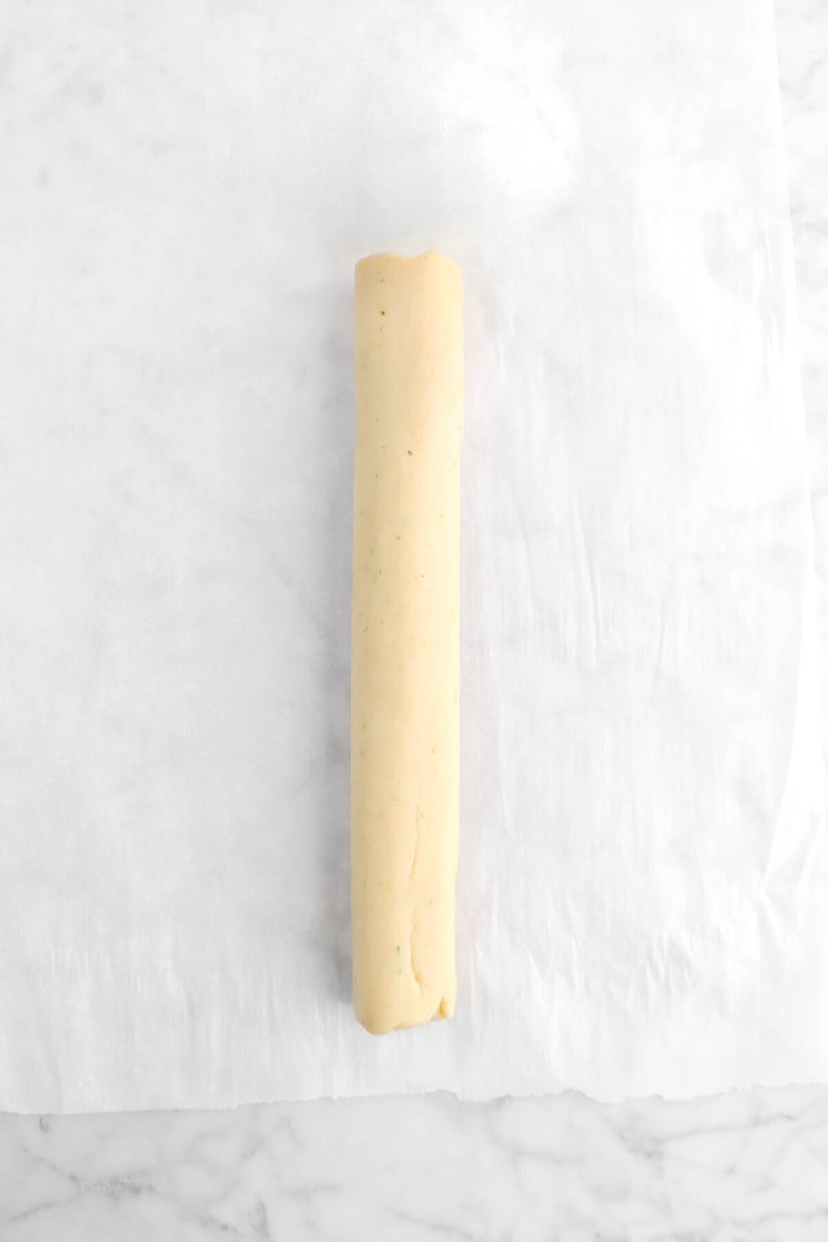rolled shortbread dough on parchment paper
