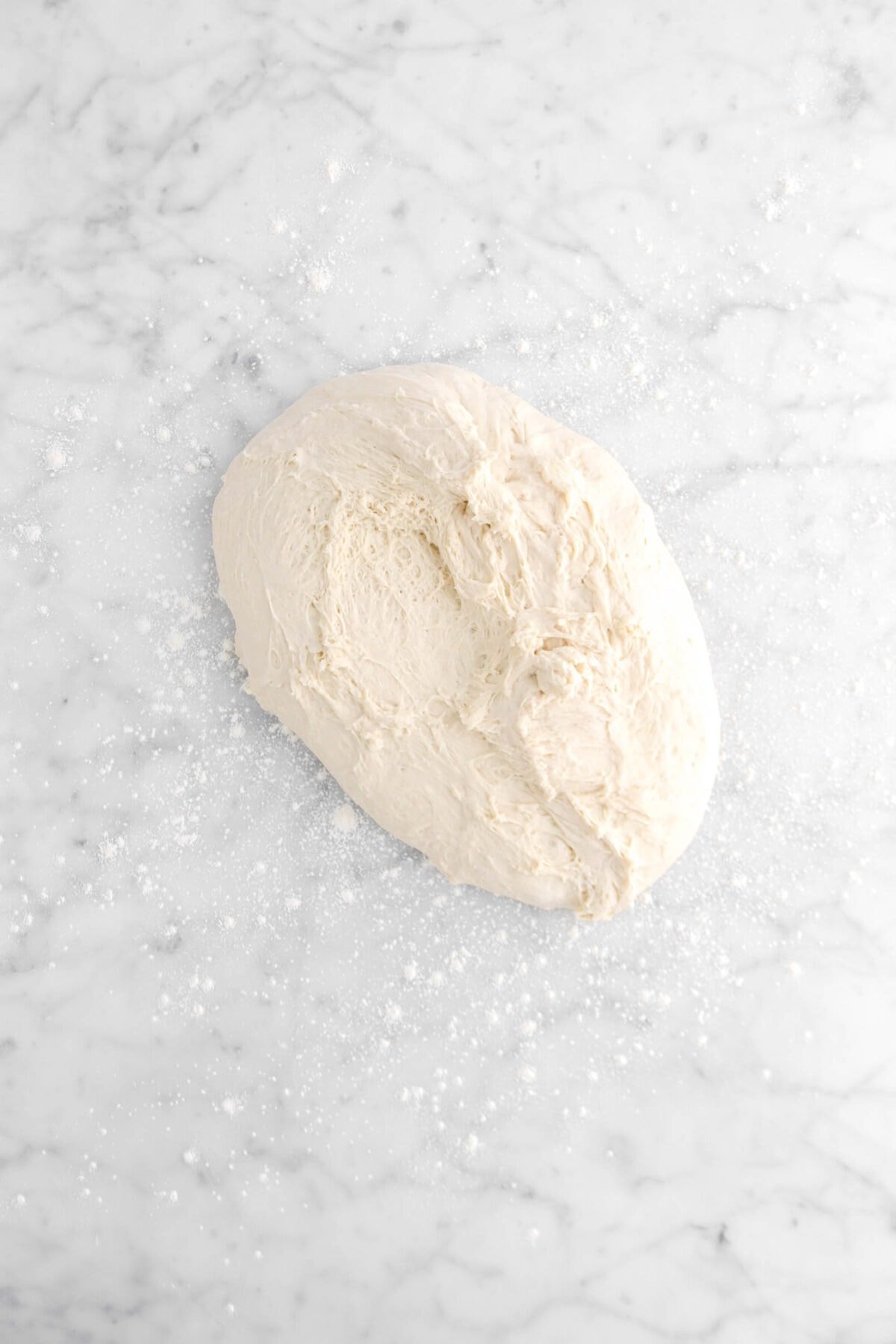 dough on floured marble surface