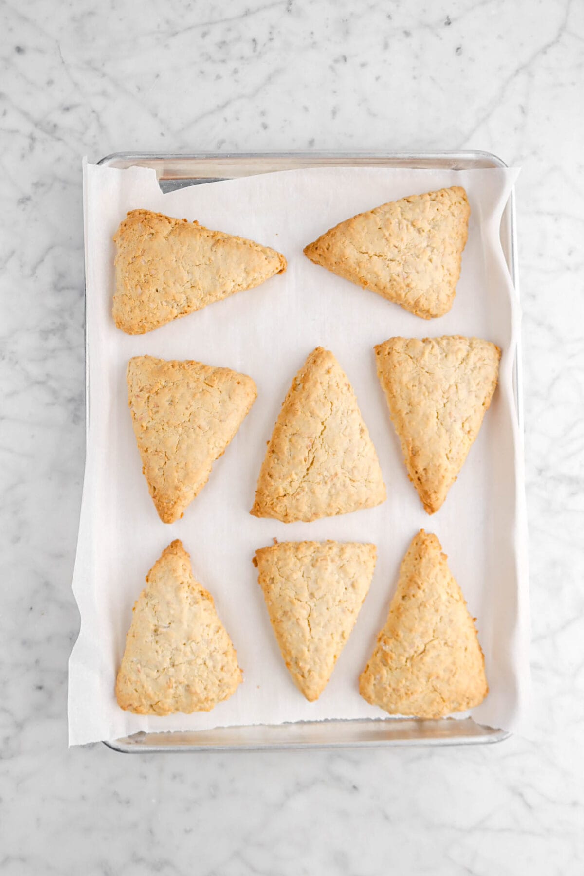 eight baked scones on lined sheet pan