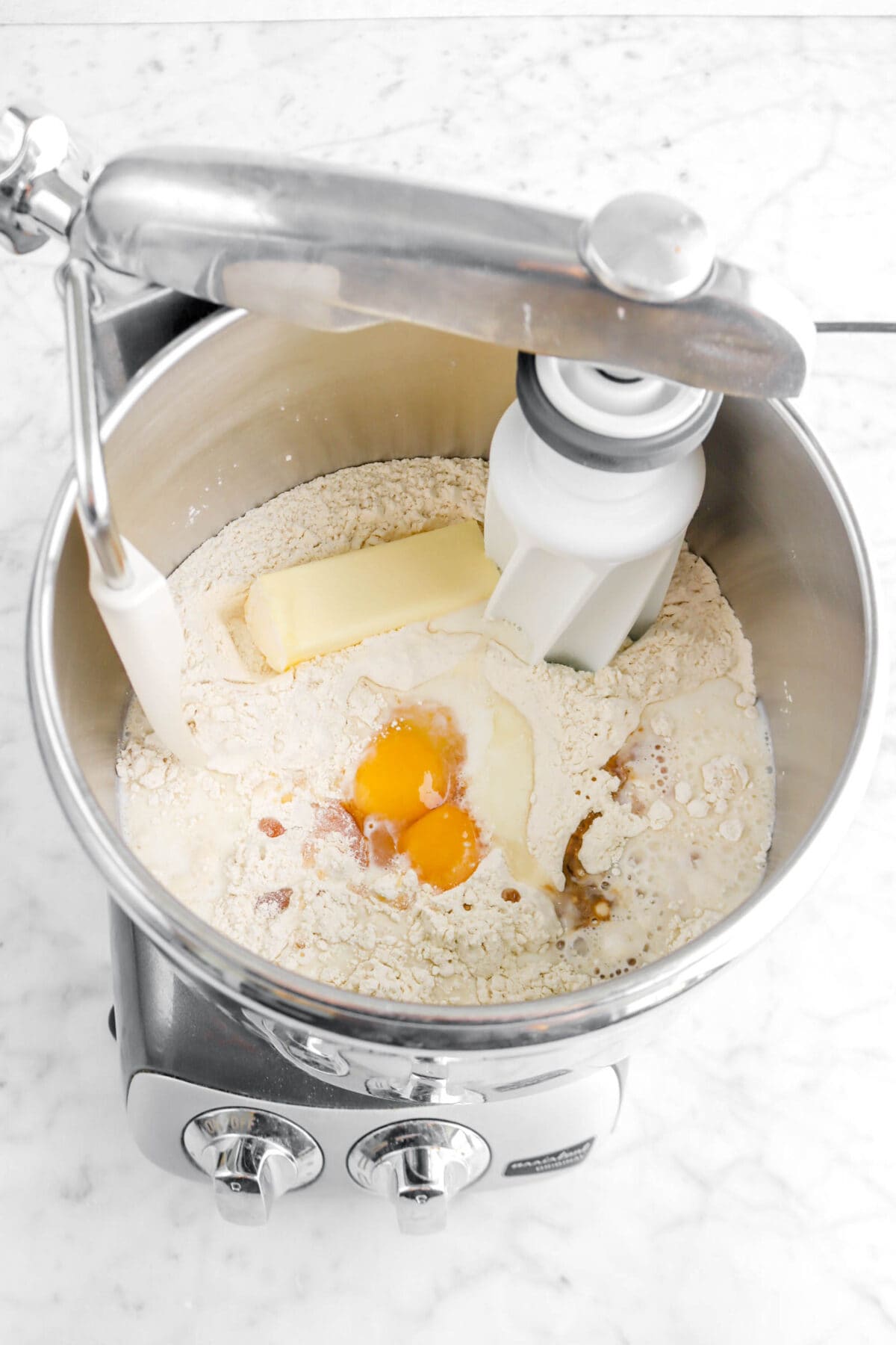 butter, eggs, milk, vanilla, and honey added to flour mixture