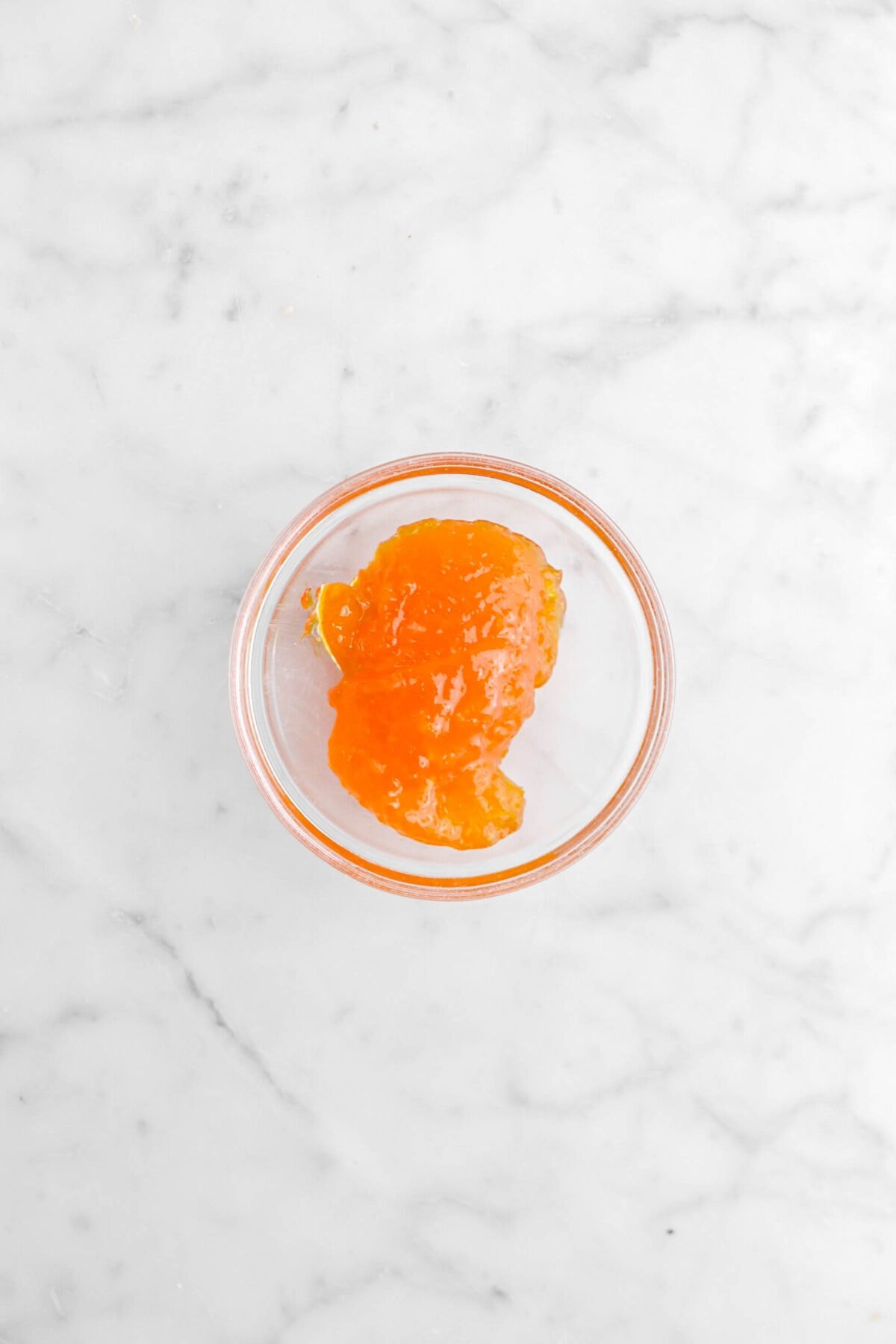 apricot jam in glass bowl