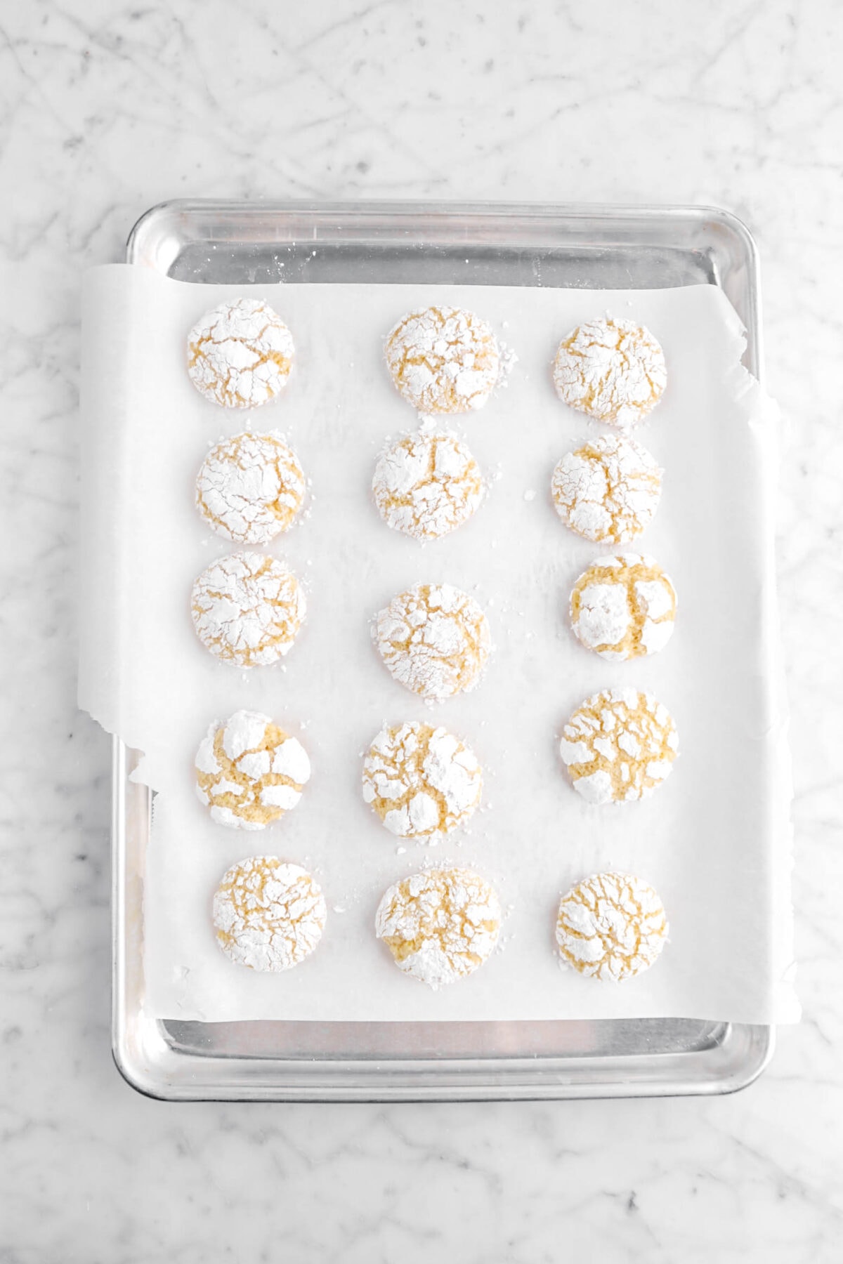 baked lemon crinkle cookies on sheet pan