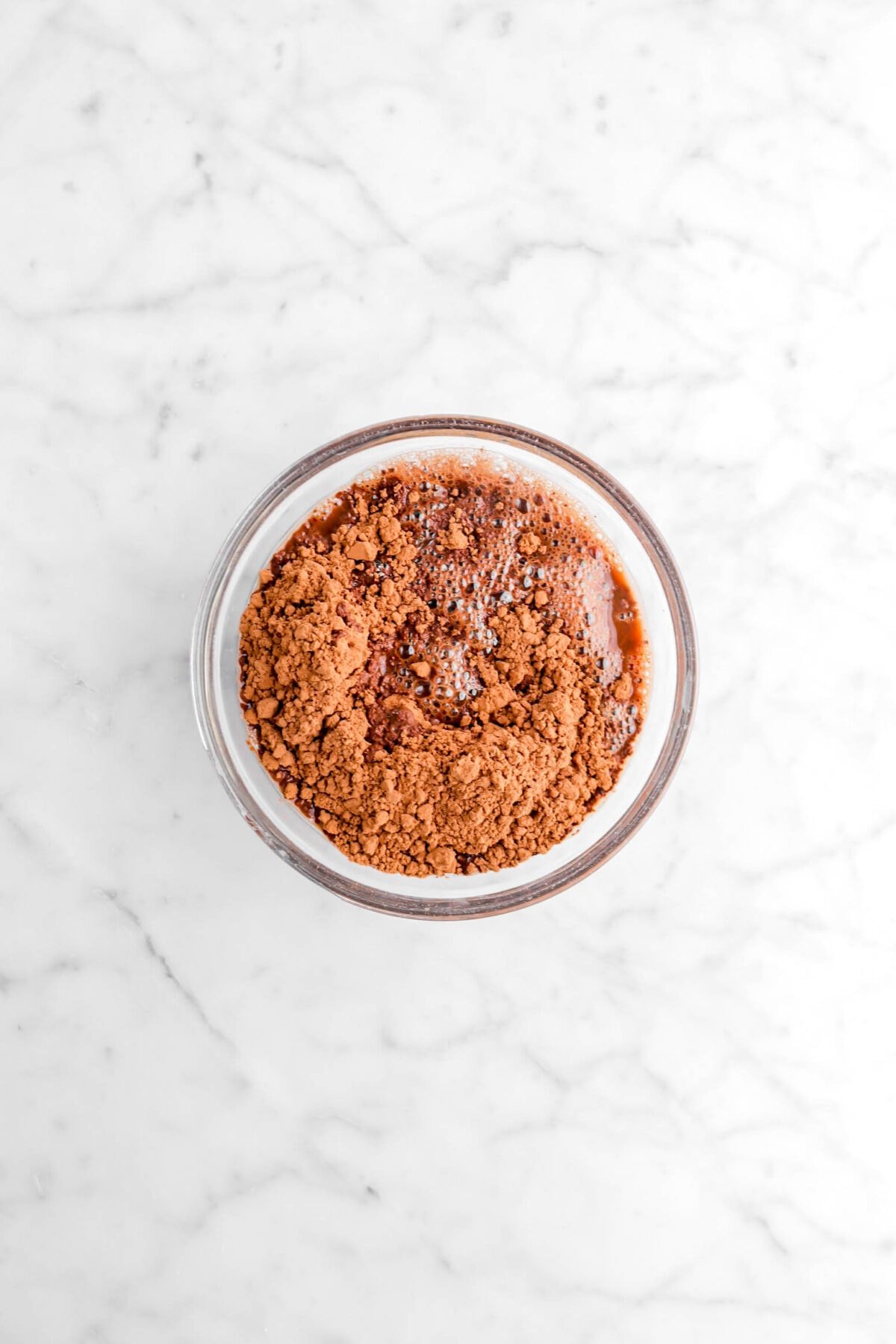 cocoa powder and water in glass bowl