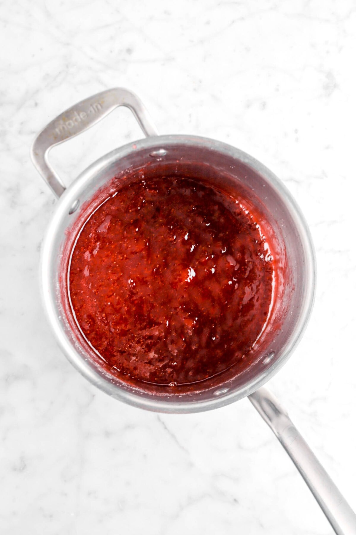 strawberry jam in small pot.