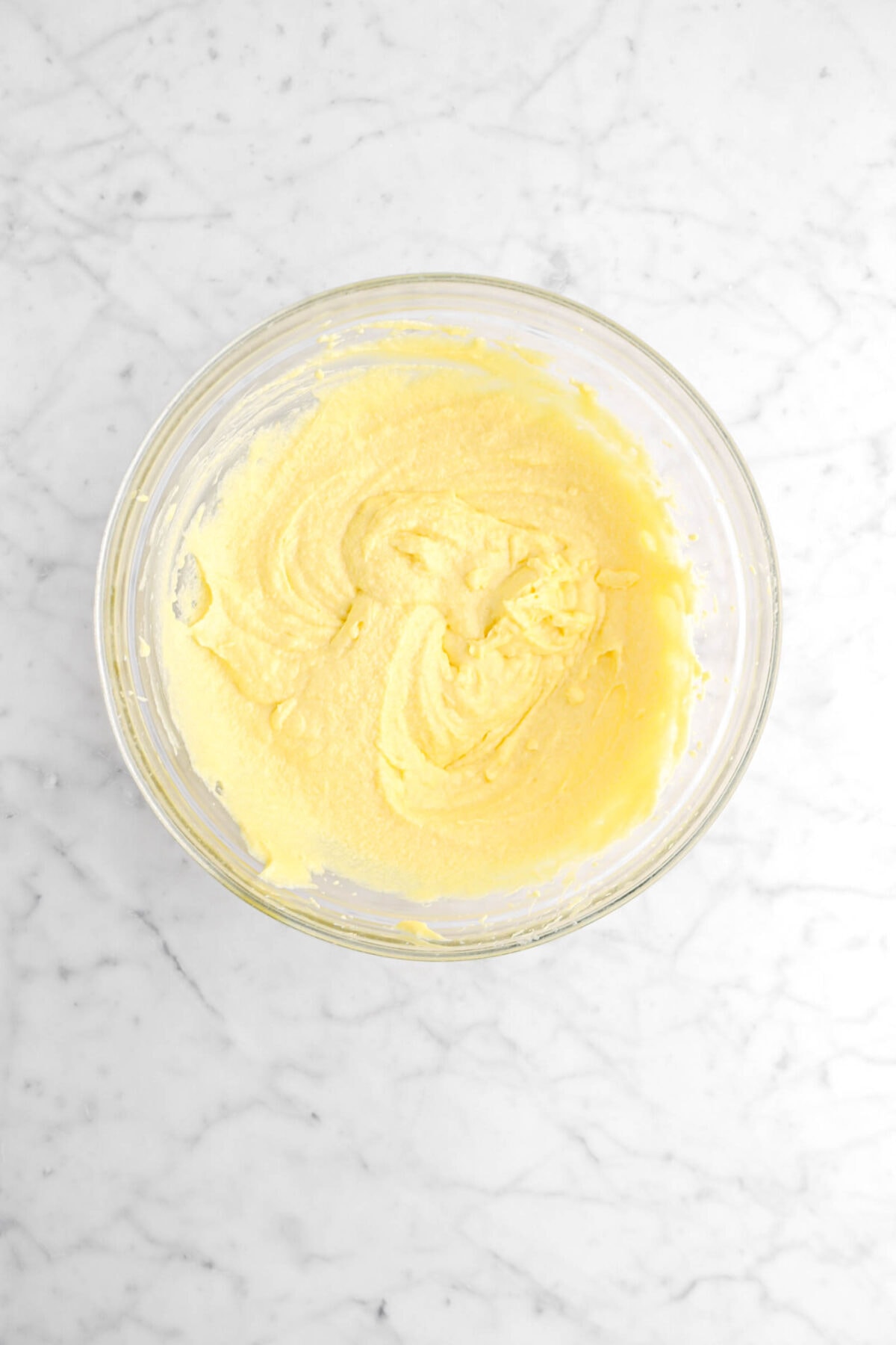 mascarpone and egg yolk mixture in glass bowl