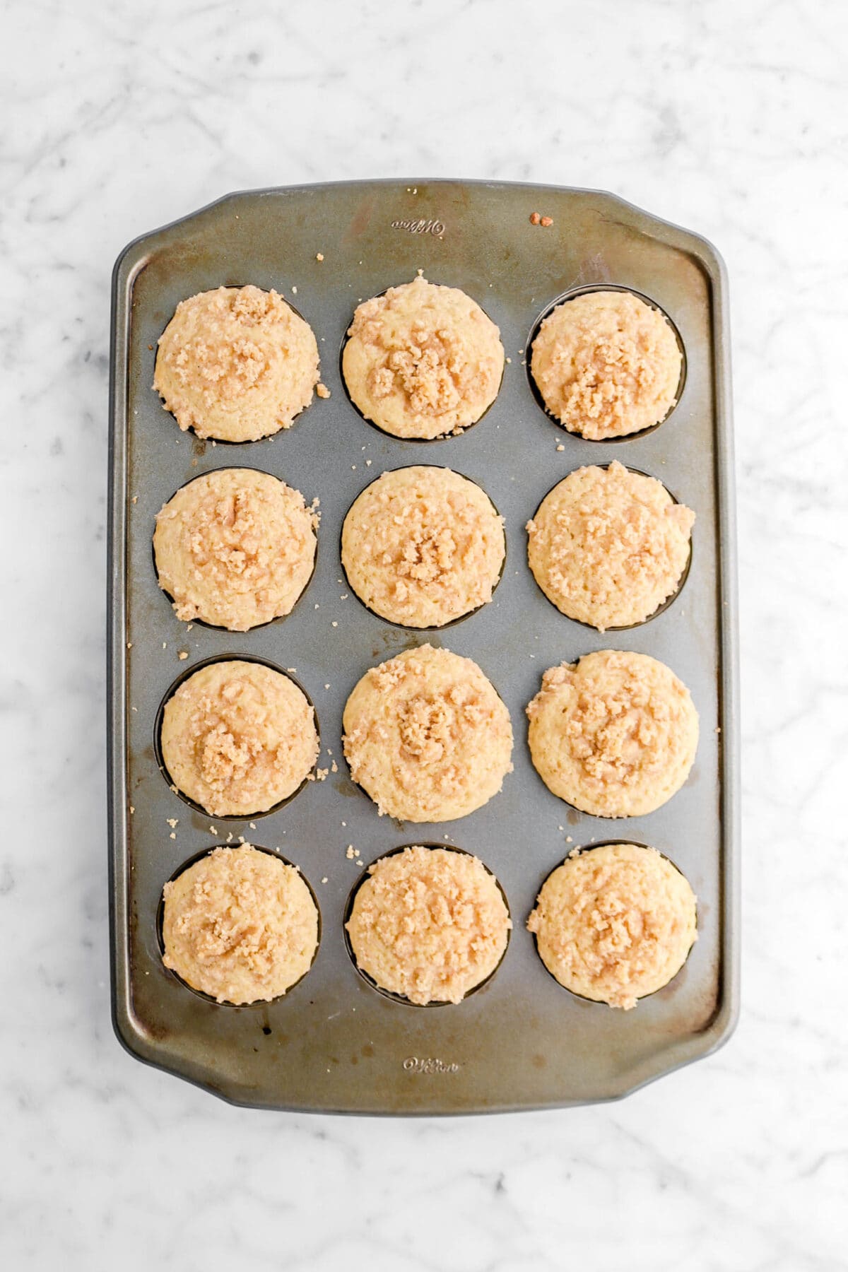 twelve baked muffins in cupcake pan