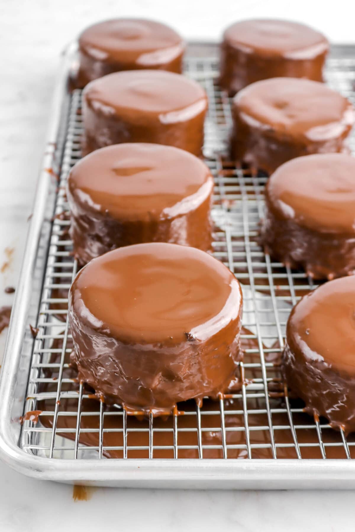 mini cakes covered in melted chocolate