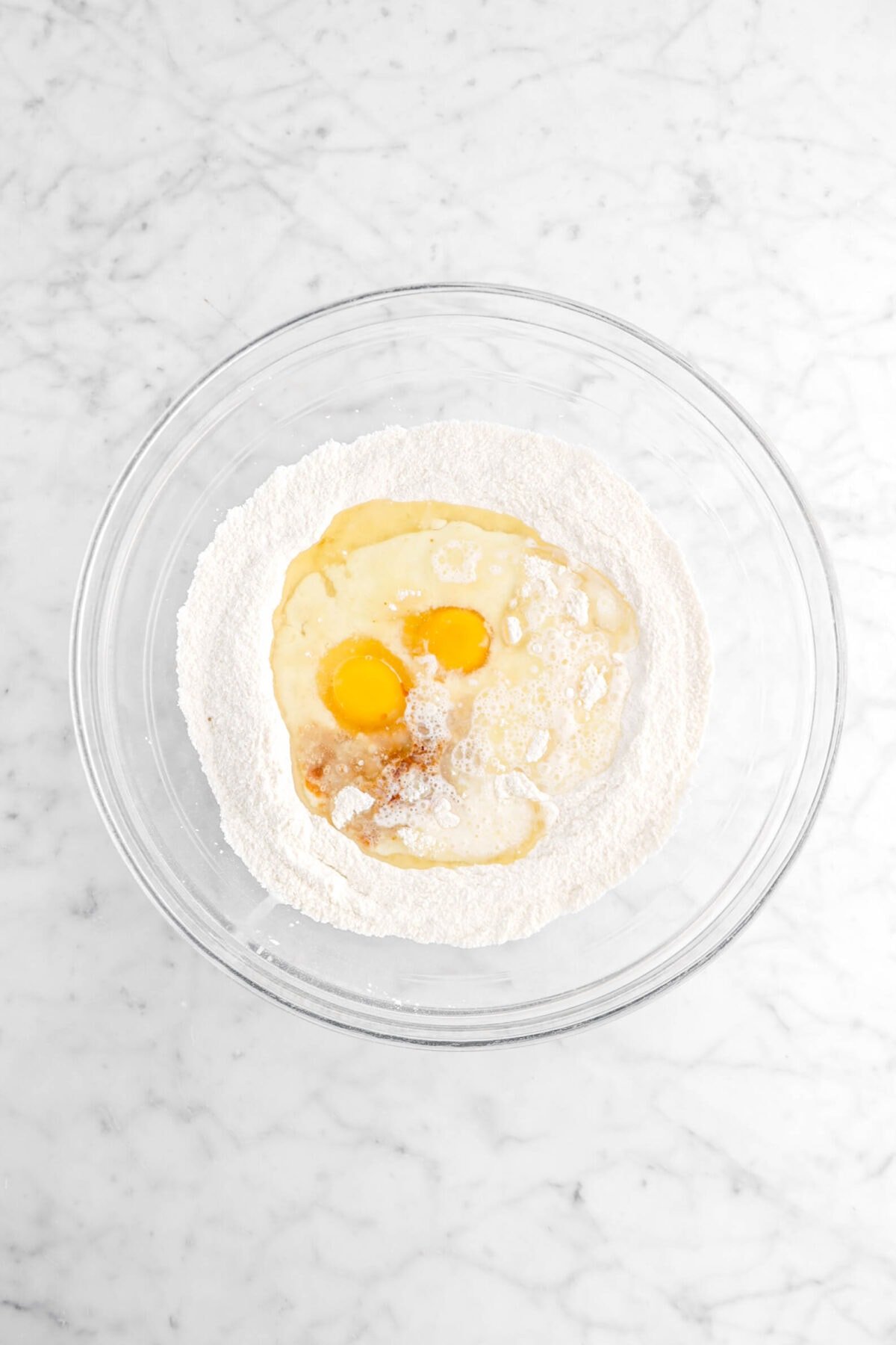 eggs, milk, oil, and vanilla added to dry ingredients