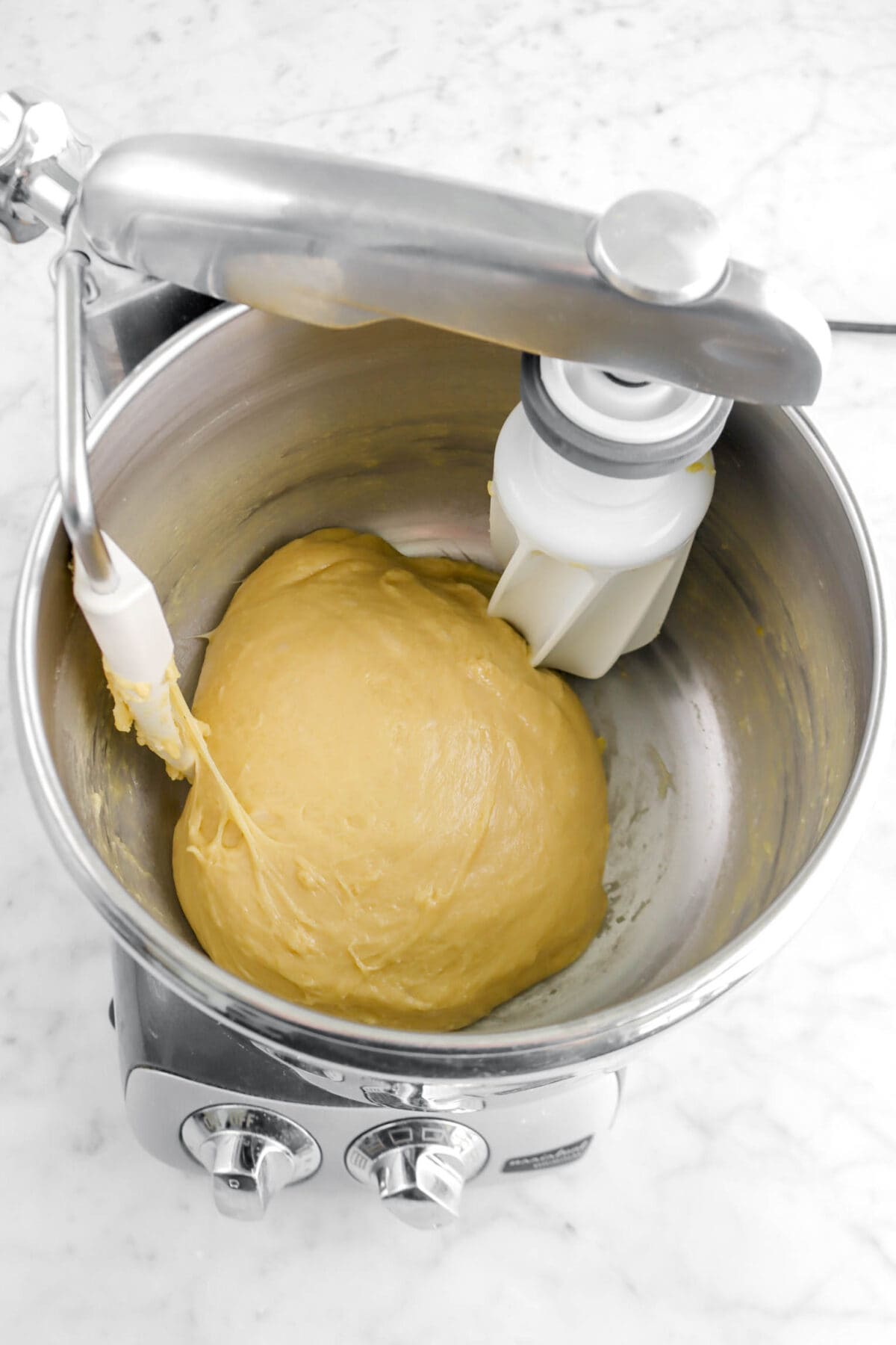 brioche dough in bowl of stand mixer