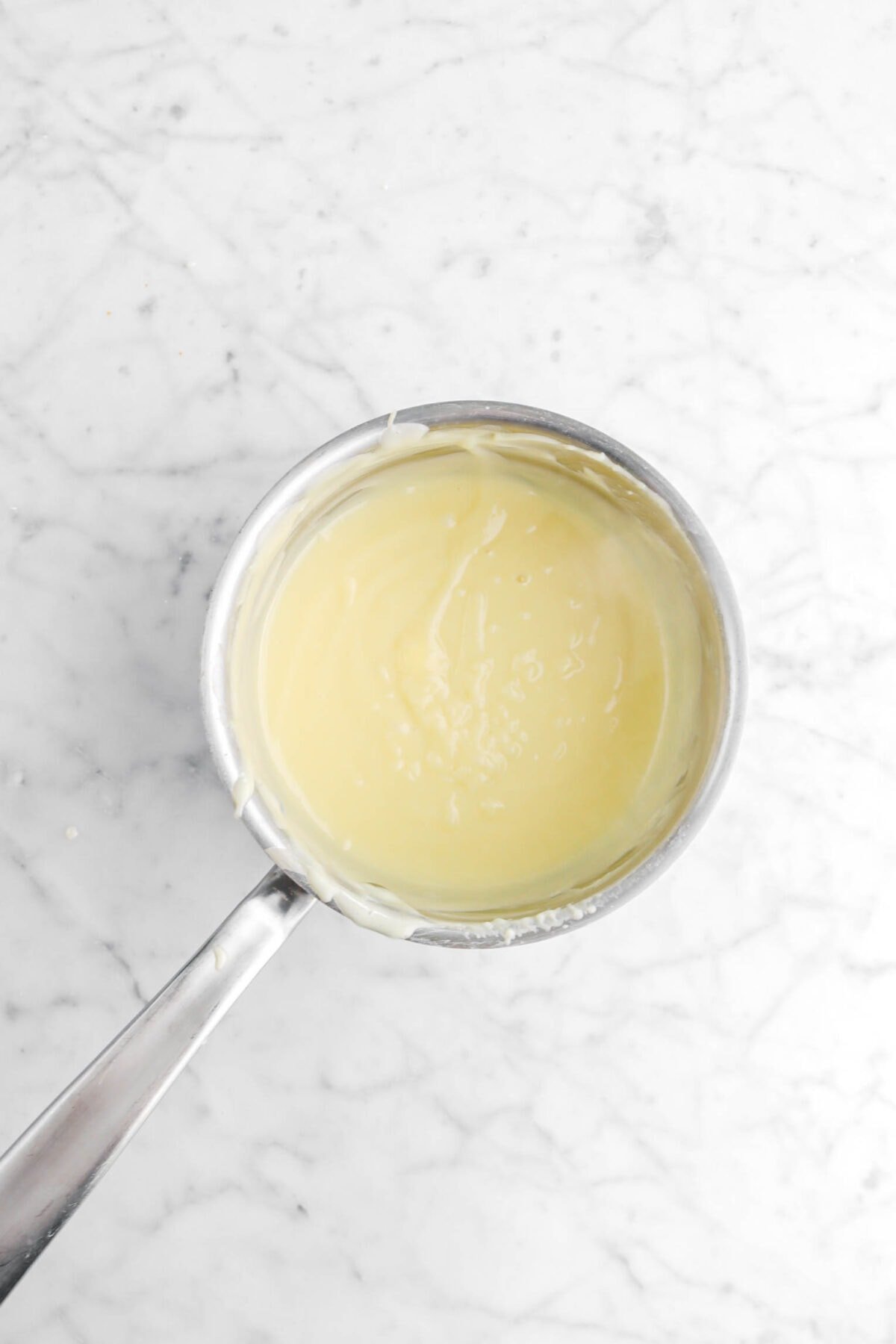 butter whisked into custard