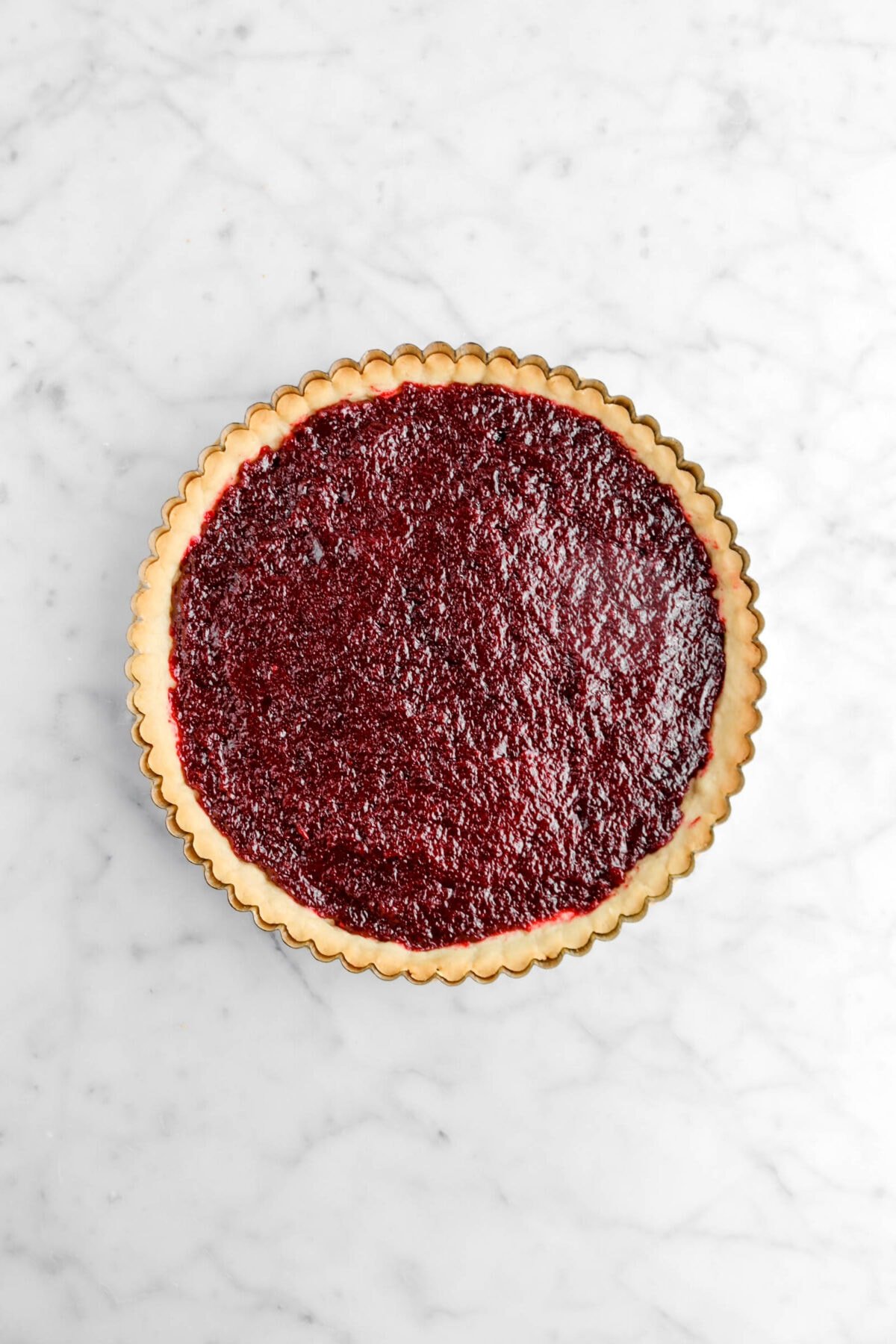 jam spread across bottom of tart