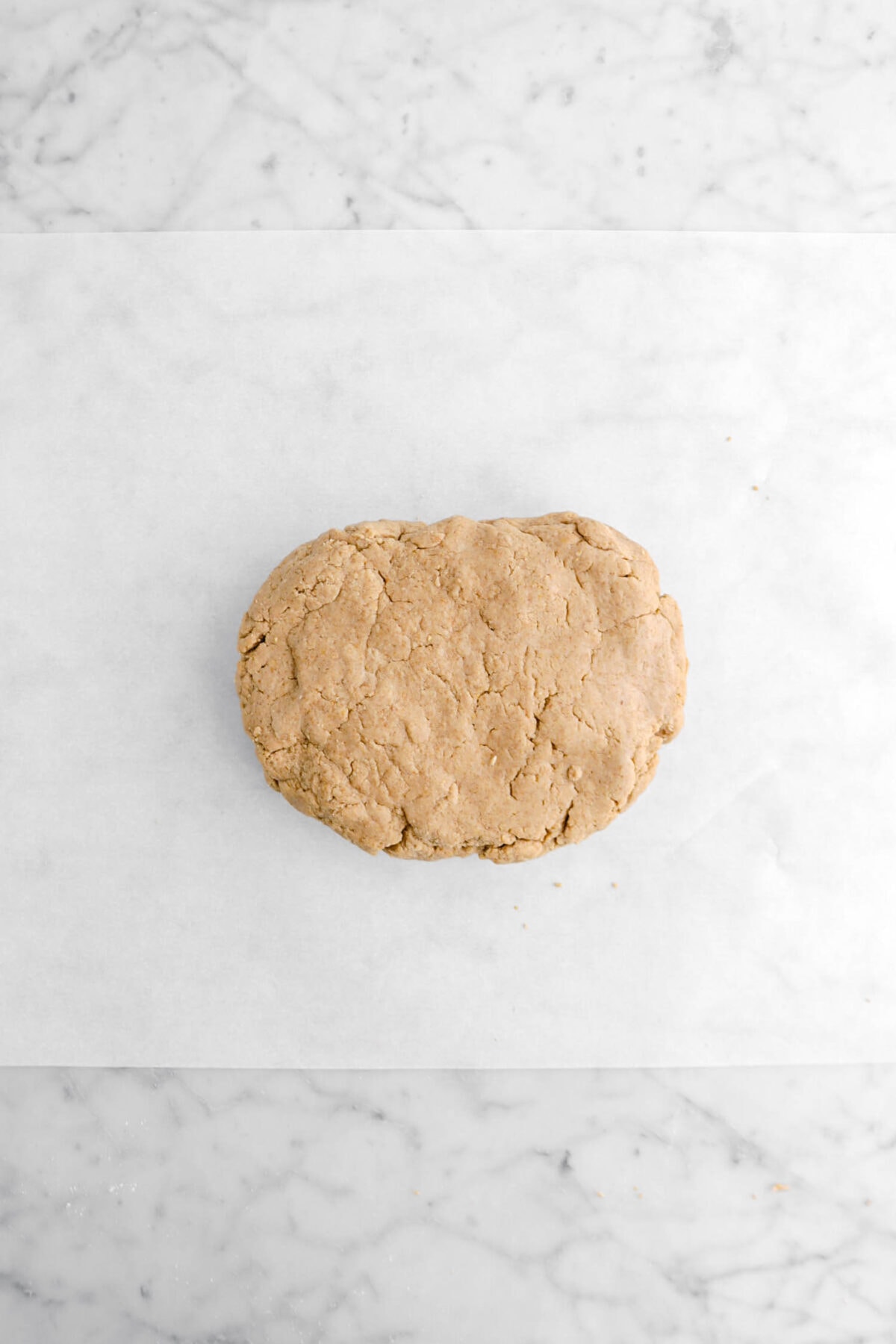 graham cracker dough on parchment paper