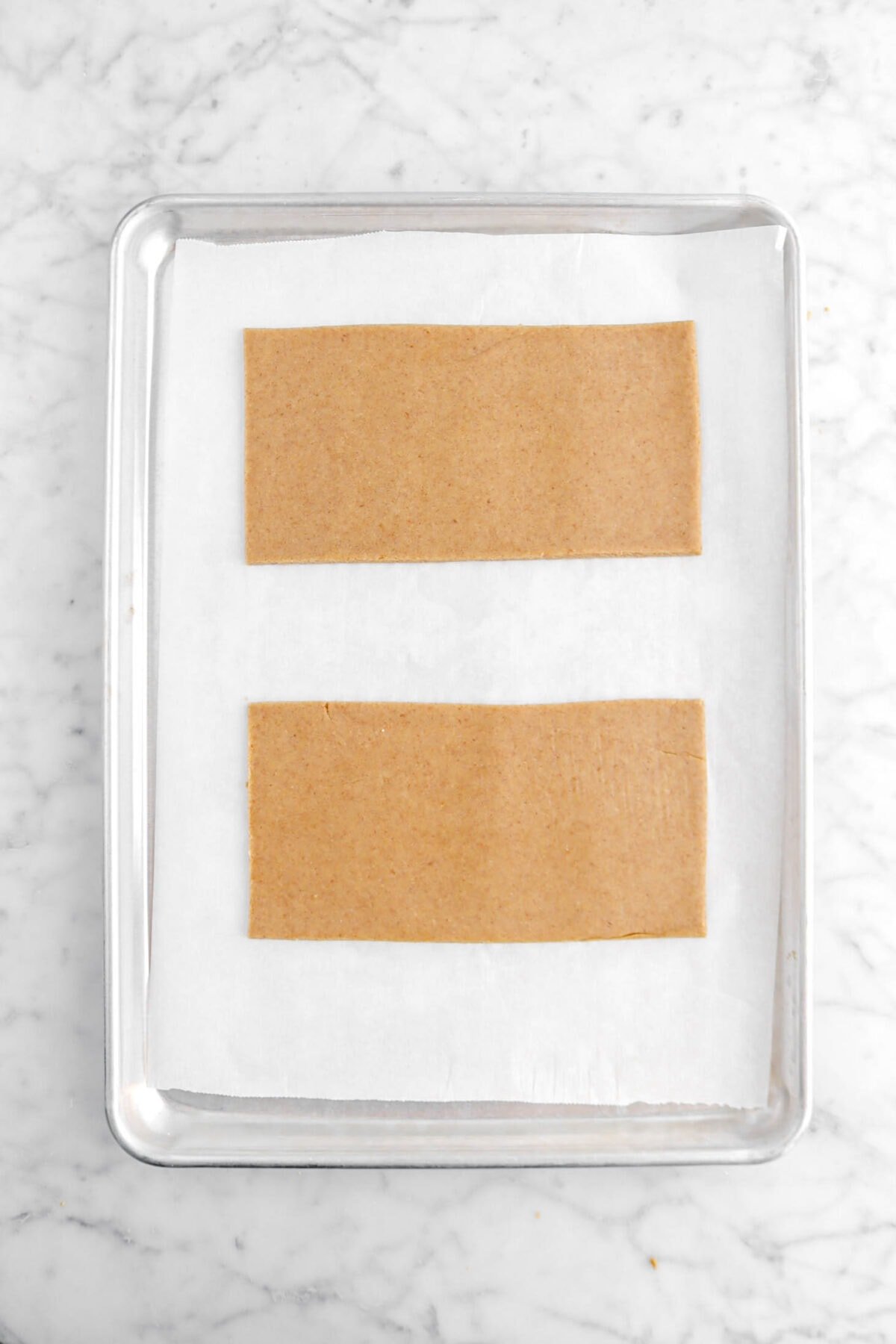 two large rectangles of dough on lined sheet pan