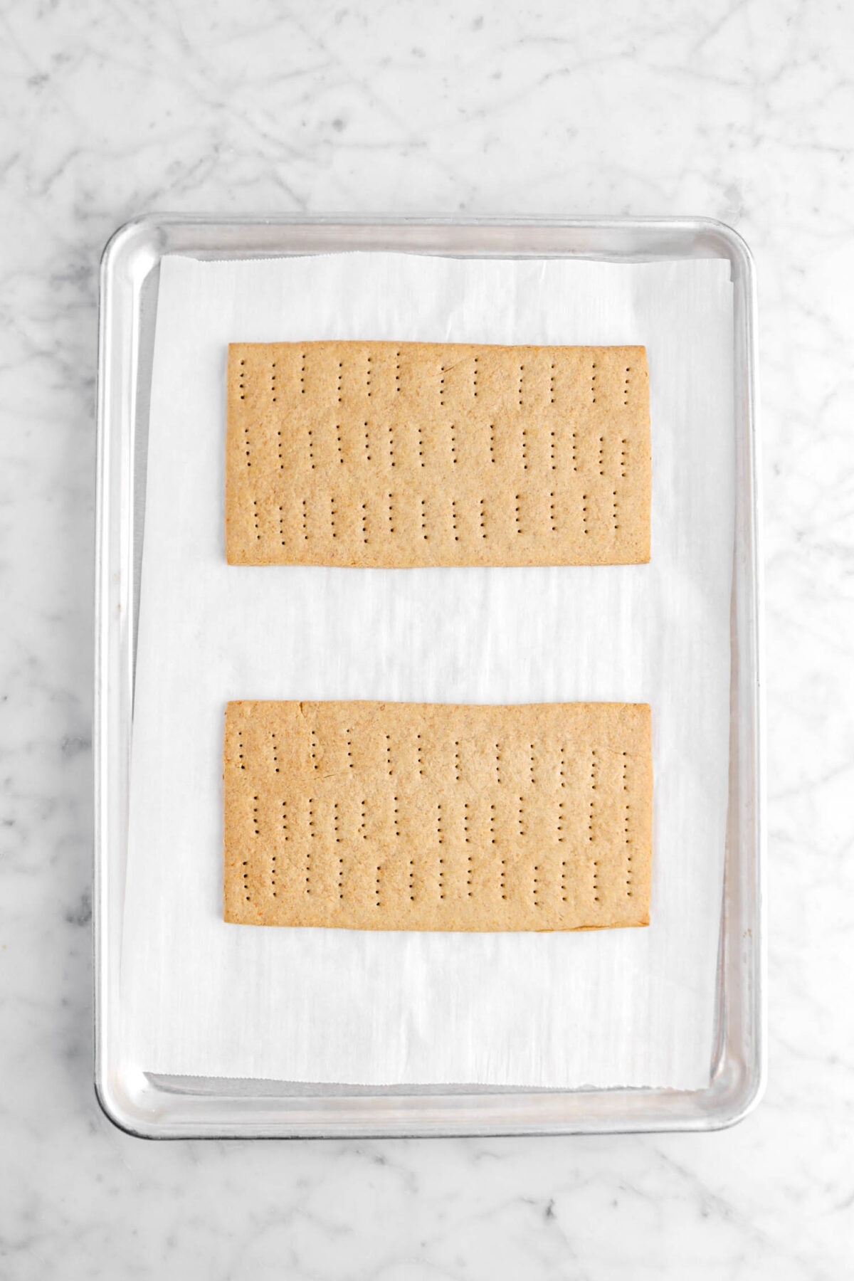 two large graham crackers baked on lined sheet pan
