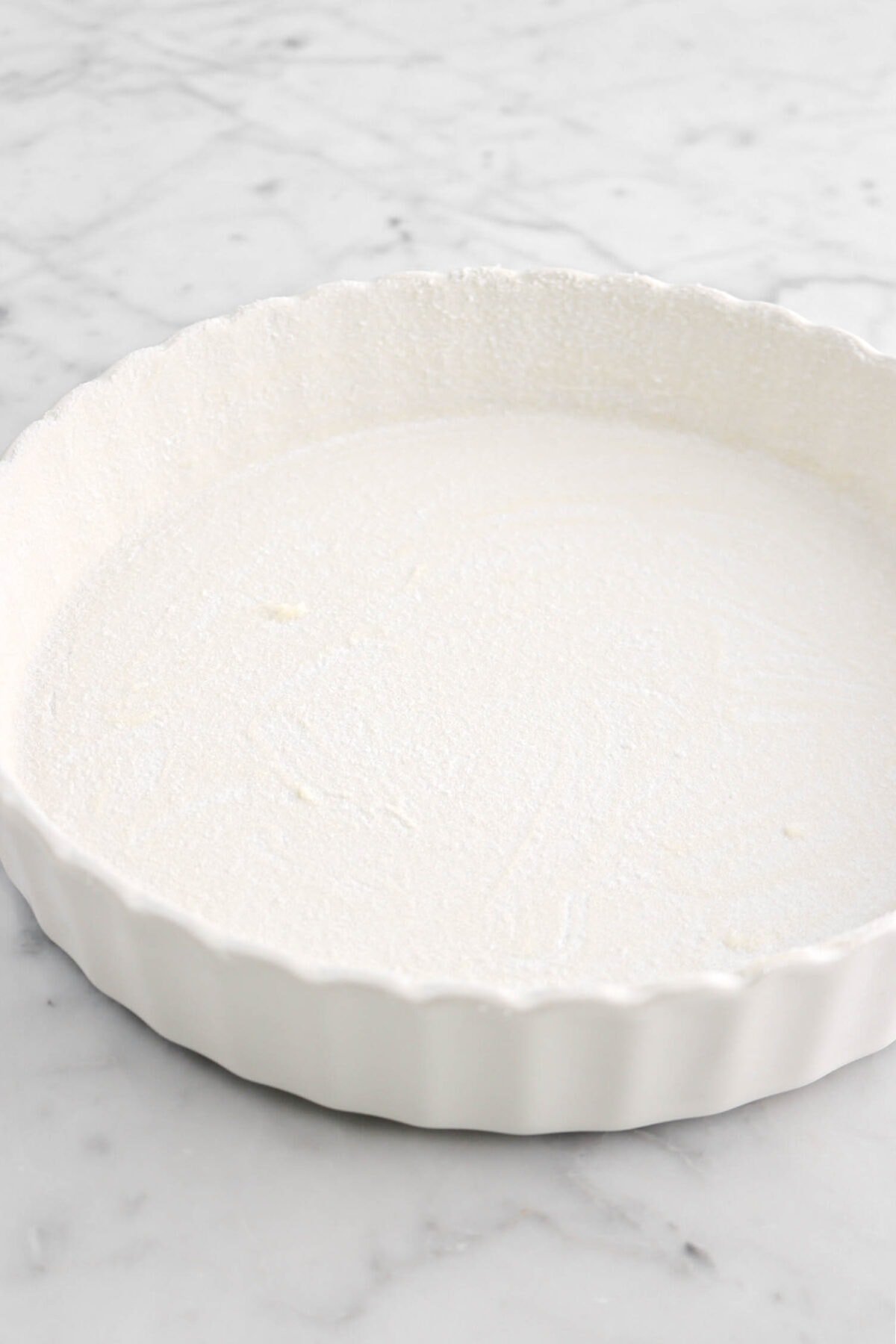 butter and sugar coating pie pan