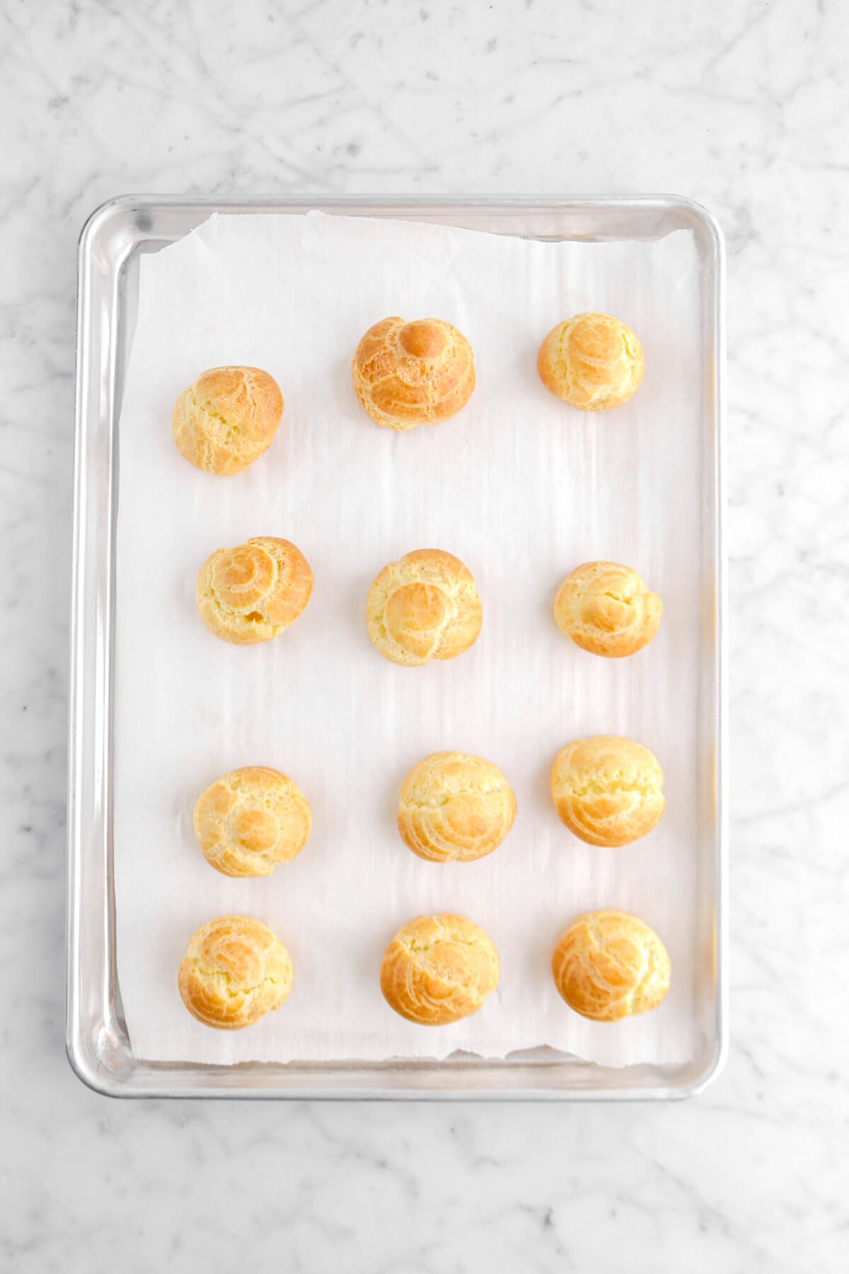 baked choux pastry on lined sheet pan
